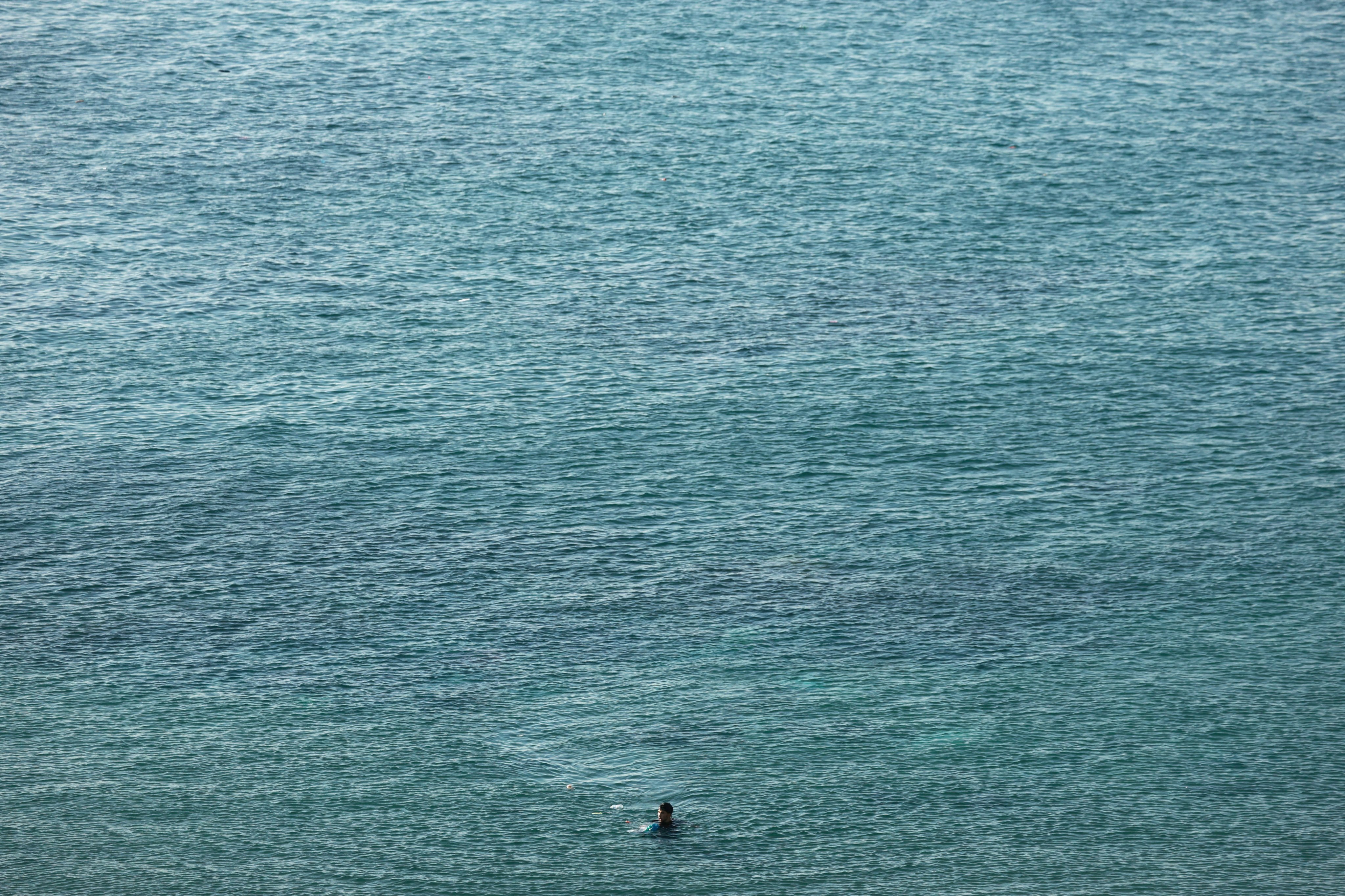 A migrant swims from Morocco to Ceuta on Sunday. Photo: Reuters