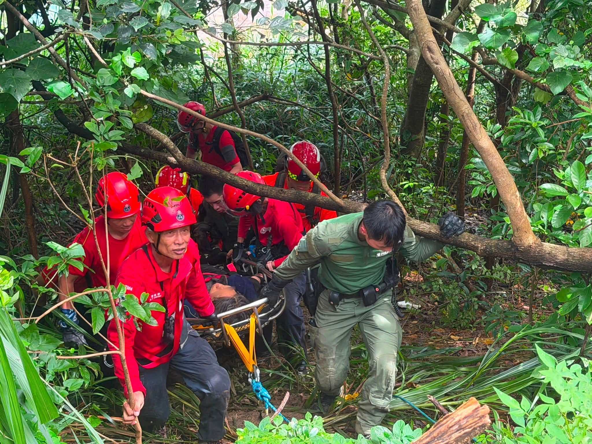 Rescuers prepare to airlift the woman after finding her on a hillside. Photo: Handout