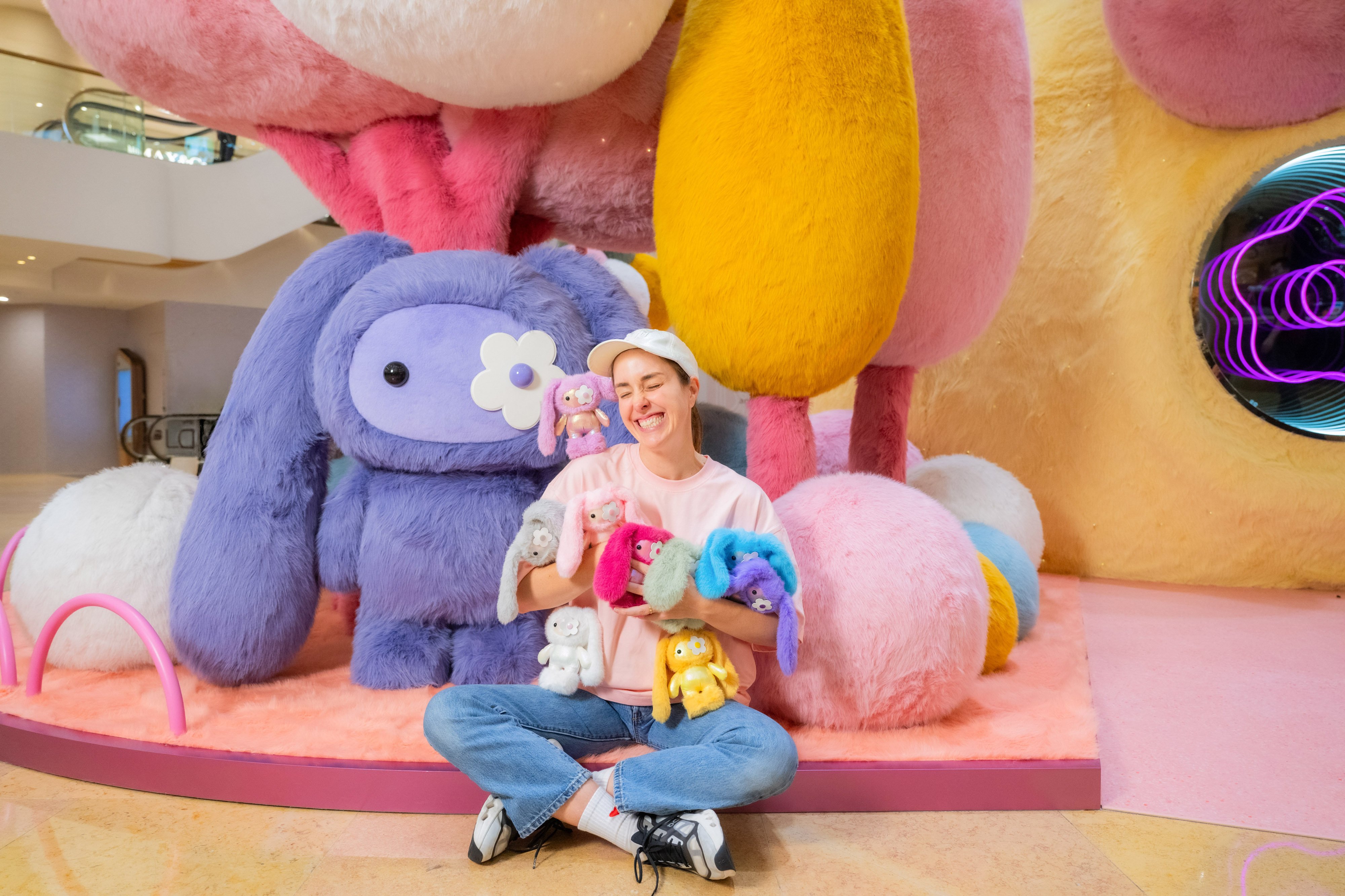 CJ Hendry with a collection of Juju plushies at “Juju World”. Photo: courtesy Pacific Place