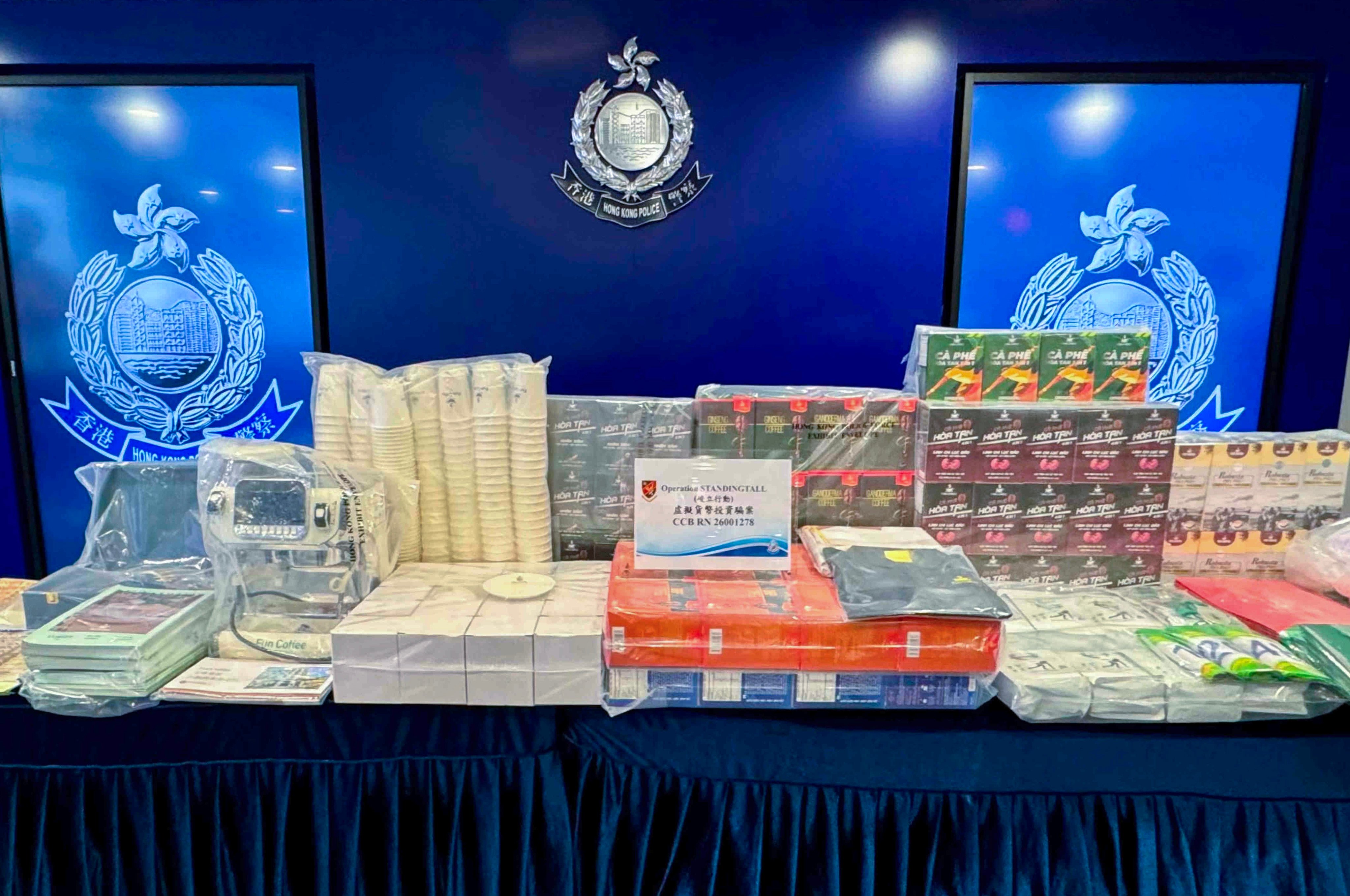 Police seized HK$147,000 in cash, 16 bank cards, six mobile phones and large amounts of documents and promotional materials. Photo: Handout