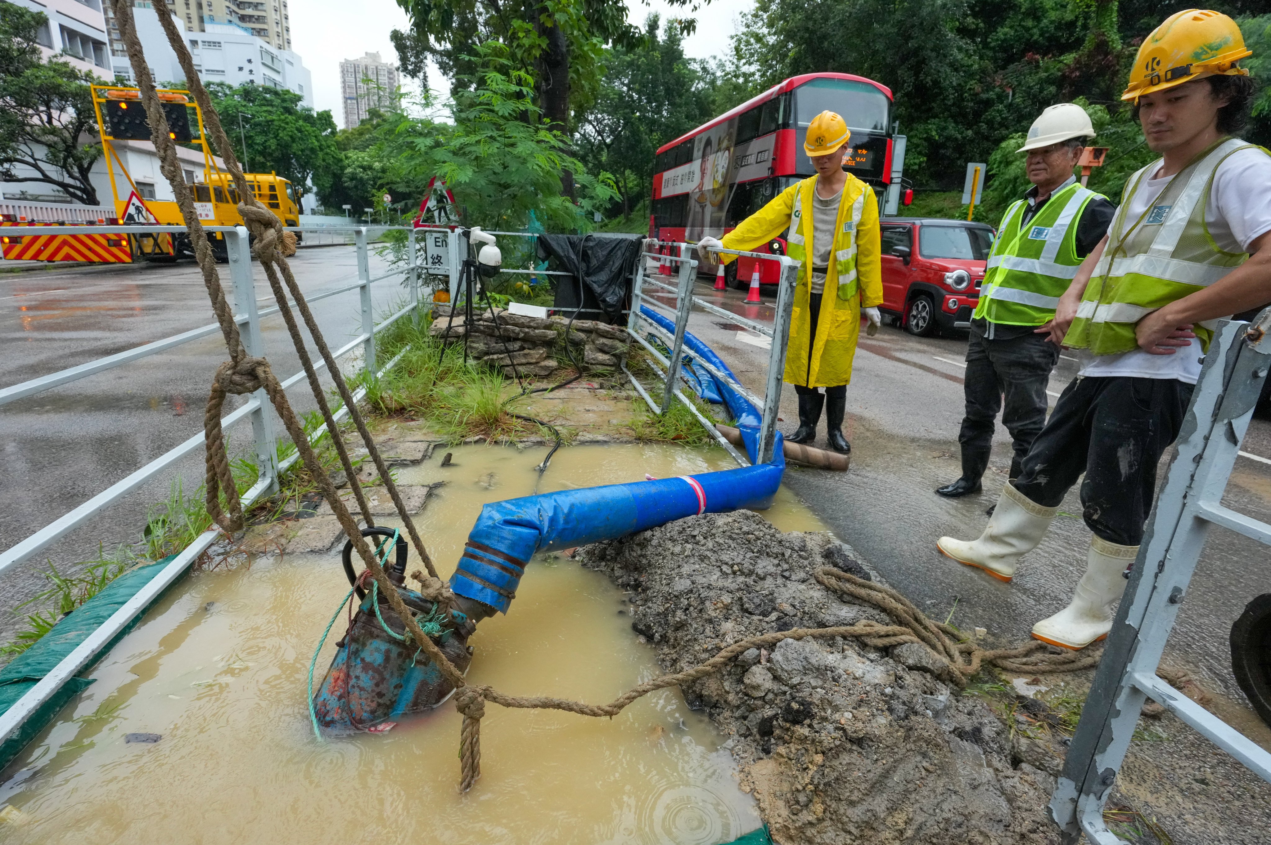 Workers from the Water Supplies Department repair a broken pipe in Tuen Mun. Photo: Jelly Tse