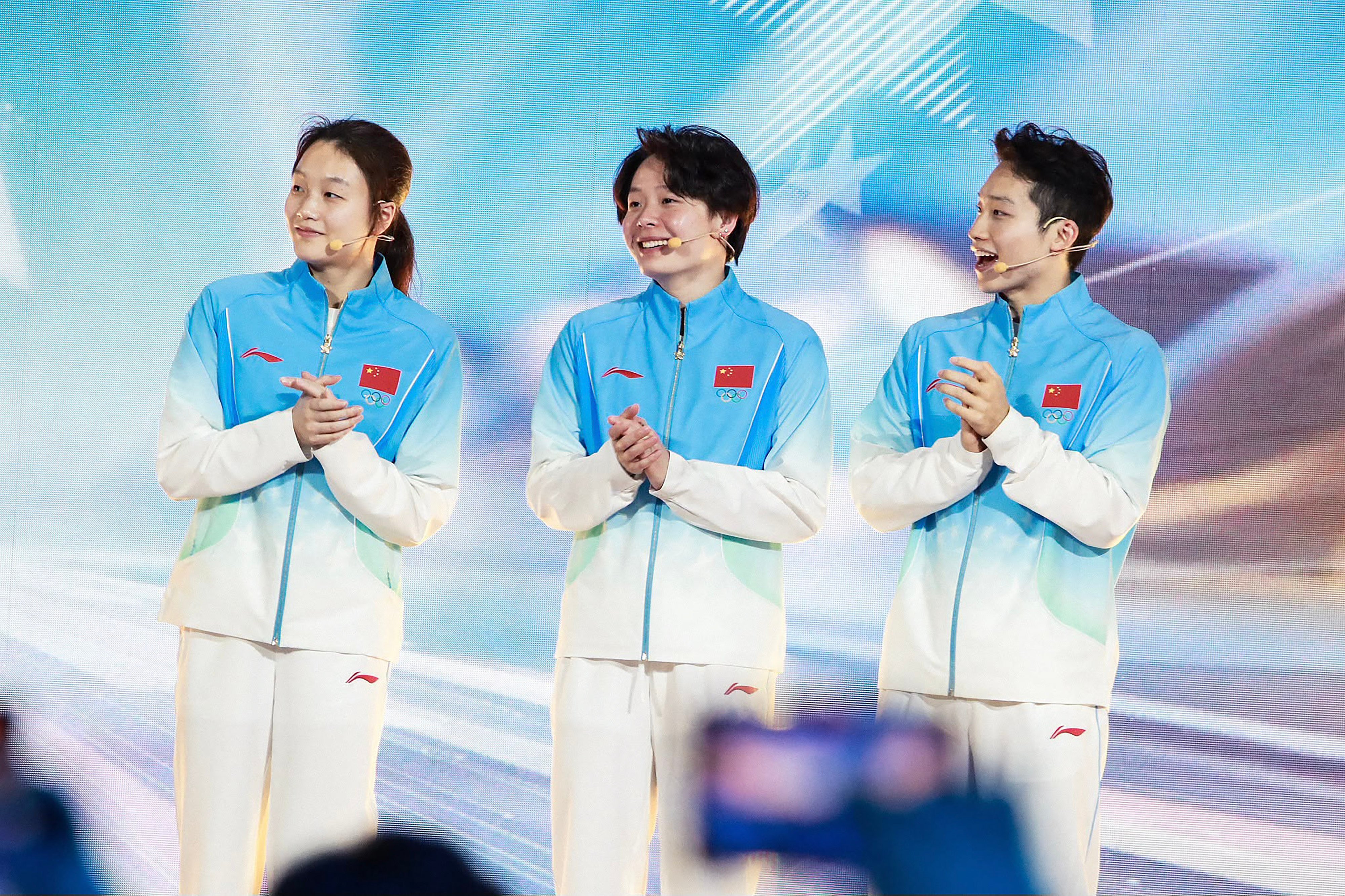 China's new victory ceremony uniforms, worn by divers (from left) Chen Jia, Chen Yiwen and Wang Zongyuan, feature a blue palette and linear star patterns. Photo: Facebook/CGTN Sports Centre
