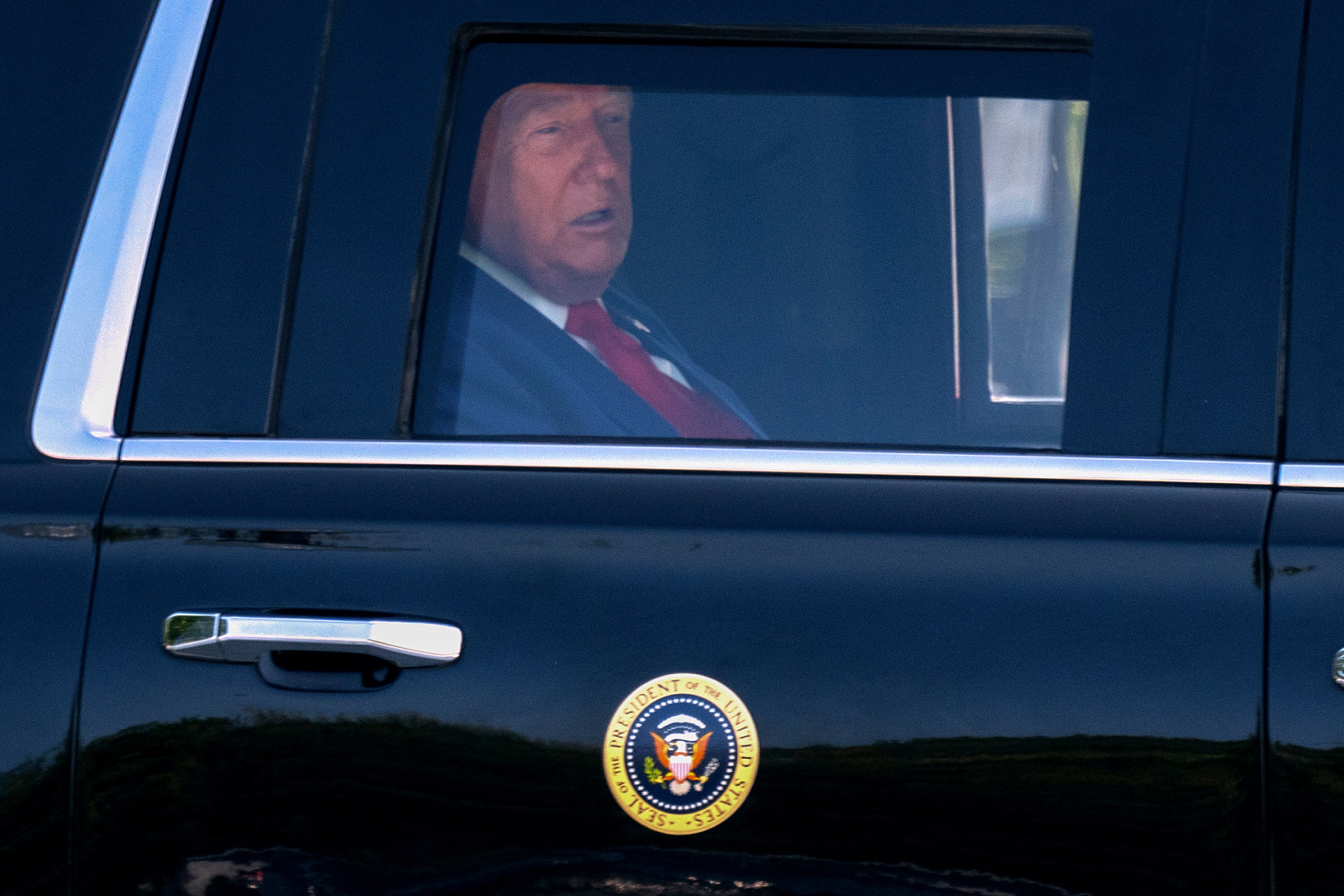 US President Donald Trump riding in his limousine. Photo: AP