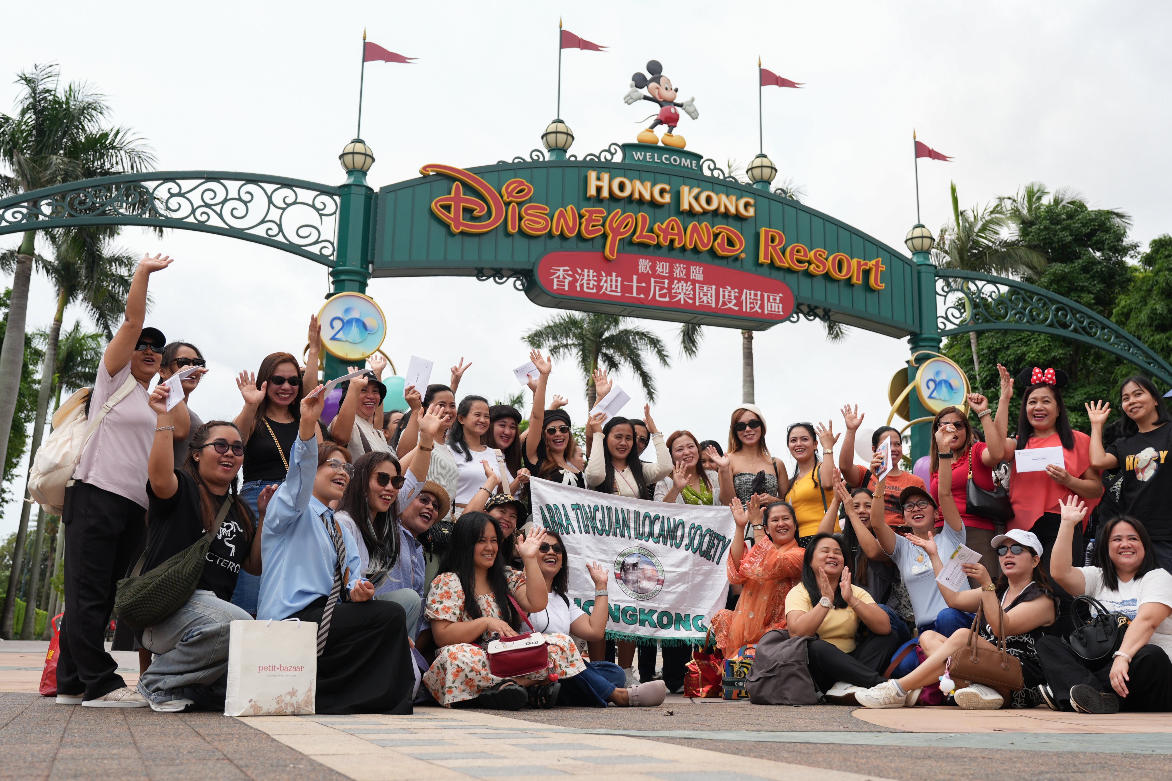 Foreign domestic helpers at Hong Kong Disneyland during a sponsored visit in April this year. Photo: Eugene Lee