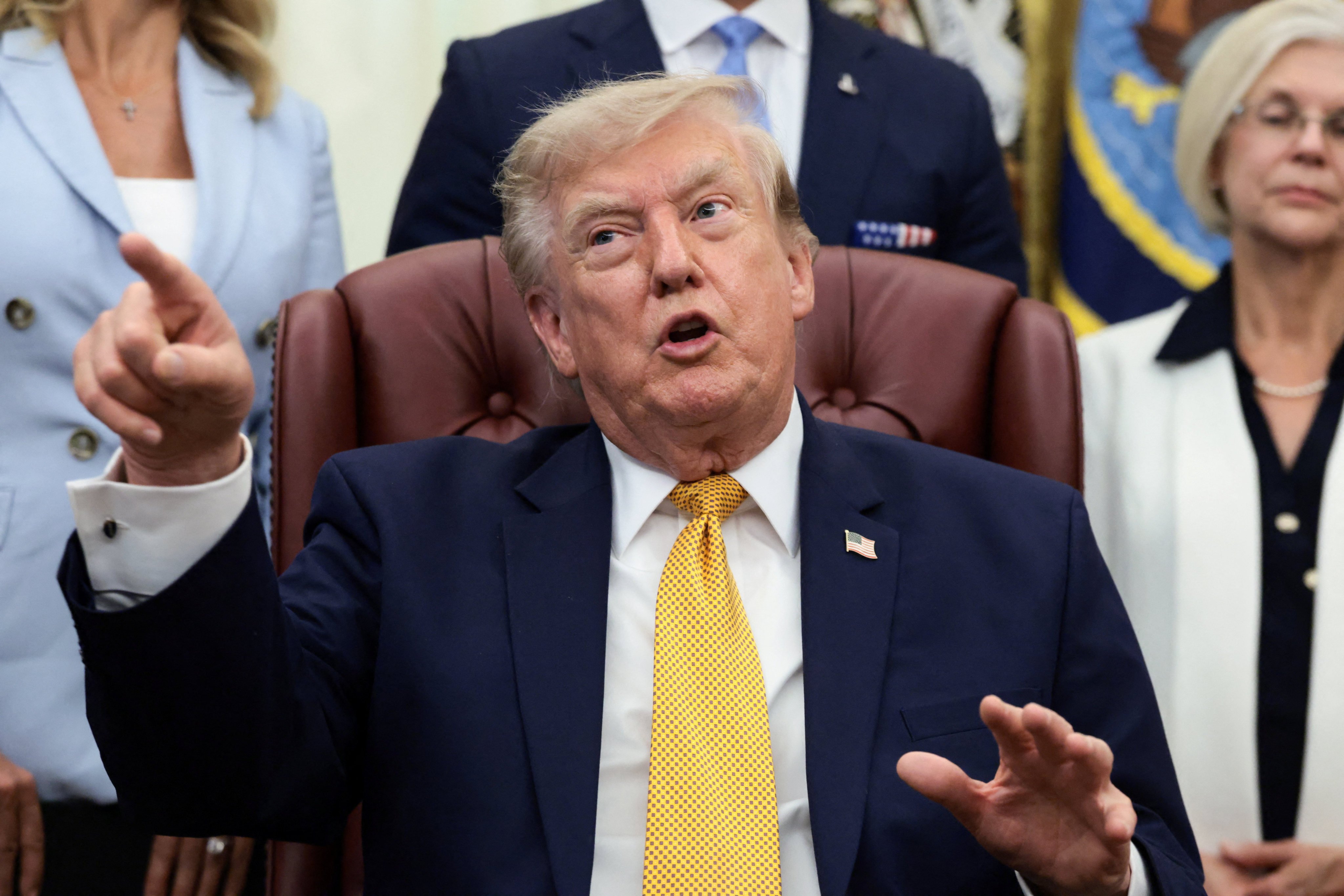 US President Donald Trump answers questions from the media in the Oval Office of the White House in Washington on Monday. Photo: Reuters