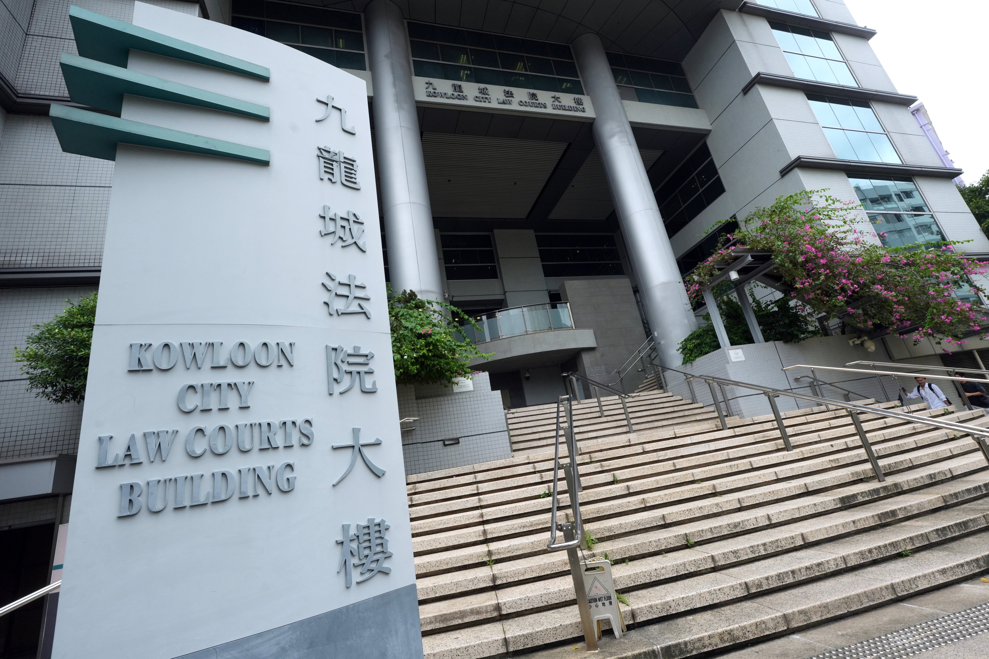 The defendant was escorted to Kowloon City Court to face a murder charge. Photo: Sun Yeung