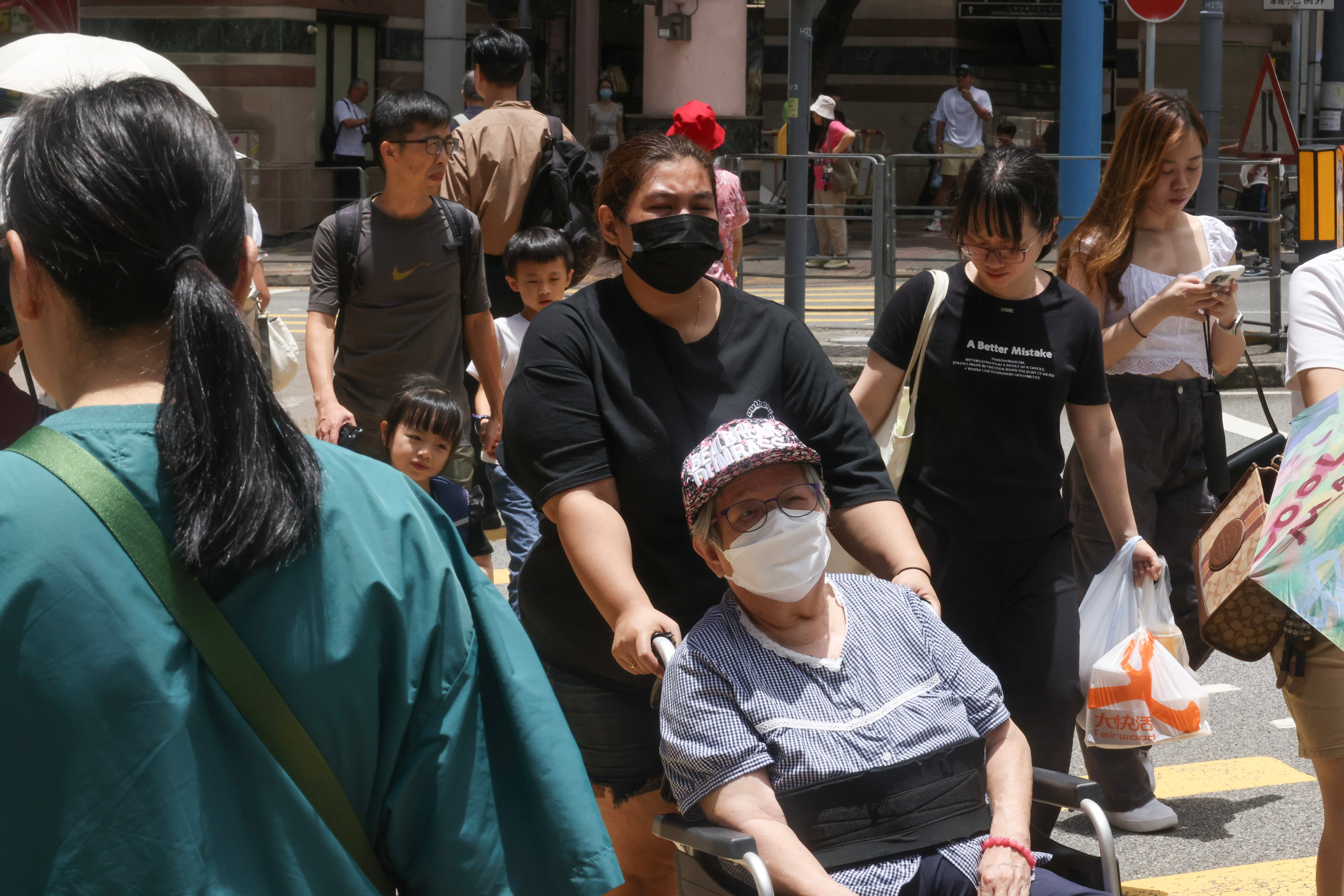 Masked pedestrians in Kennedy Town. The CHP says the public should maintain strict personal and environmental hygiene. Photo: Jonathan Wong