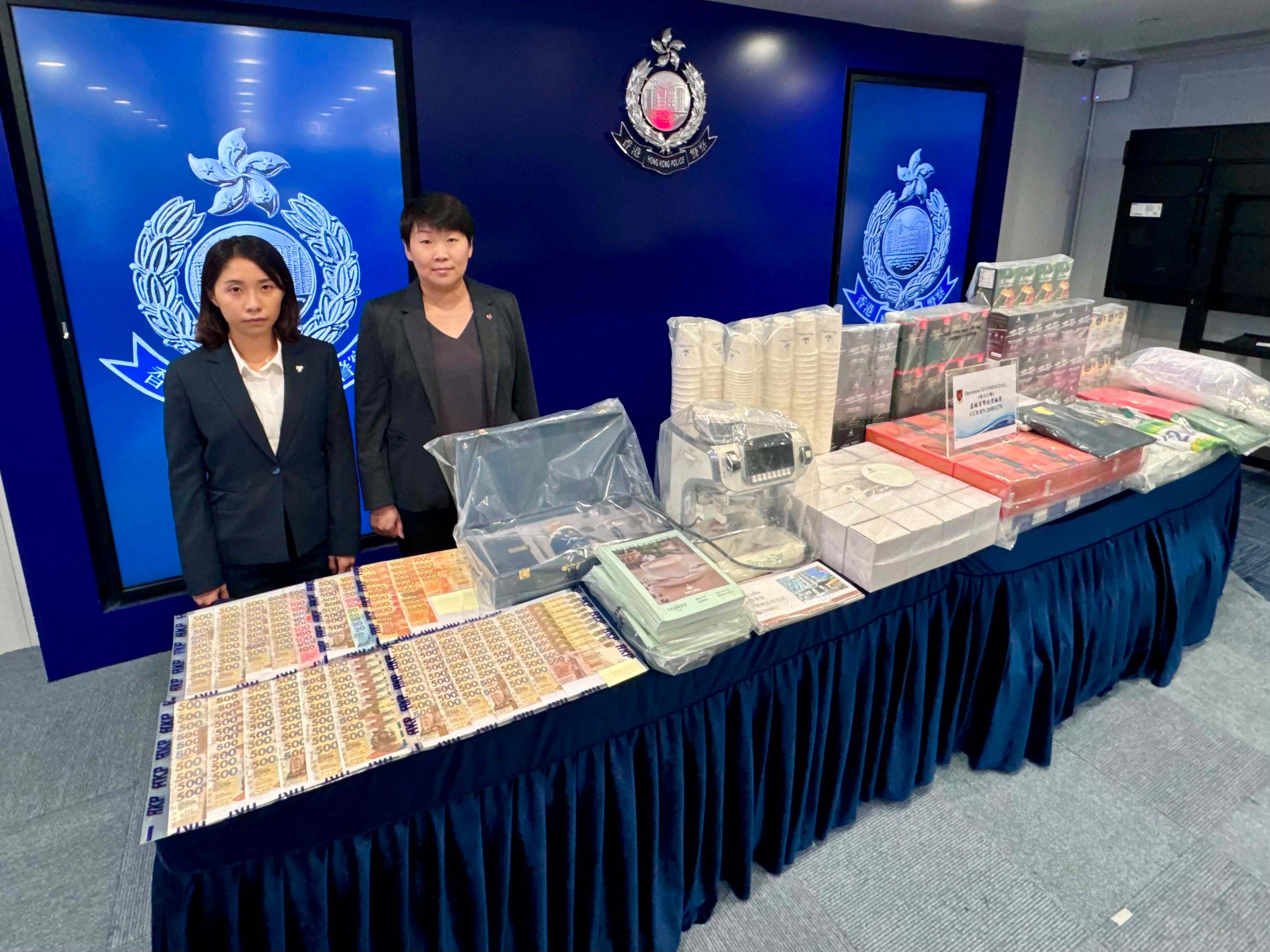 (From left) Senior Inspector Wong Sze-ki from bureau’s commercial crime division and Acting Superintendent Lo Yuen‑shan with the seized items at a media briefing. Photo: Handout