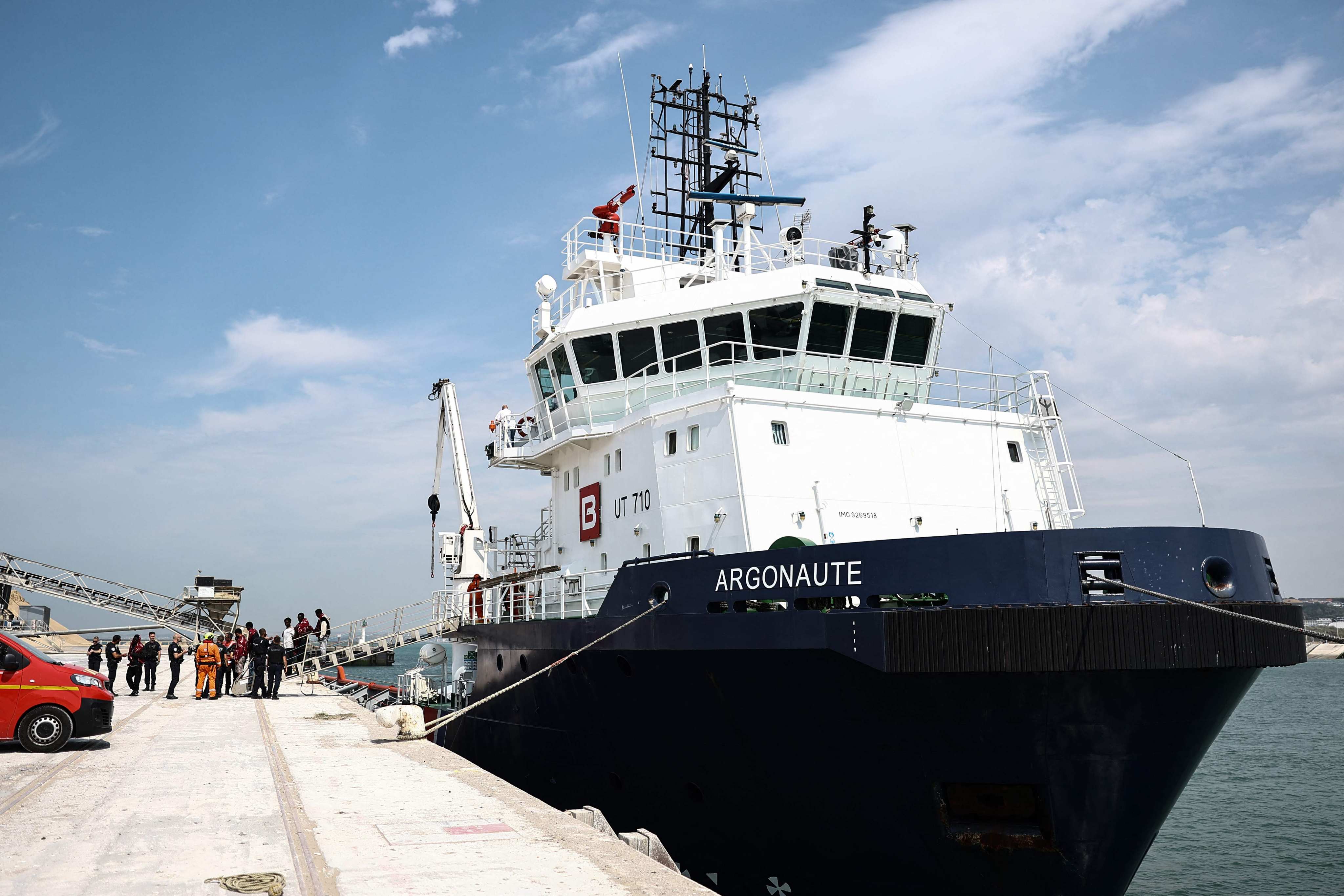 Migrants disembark from a French rescue ship in Boulogne-sur-Mer on Tuesday following their rescue at sea after their boat caught fire during an attempt to cross the English Channel from France to Britain. Photo: AFP