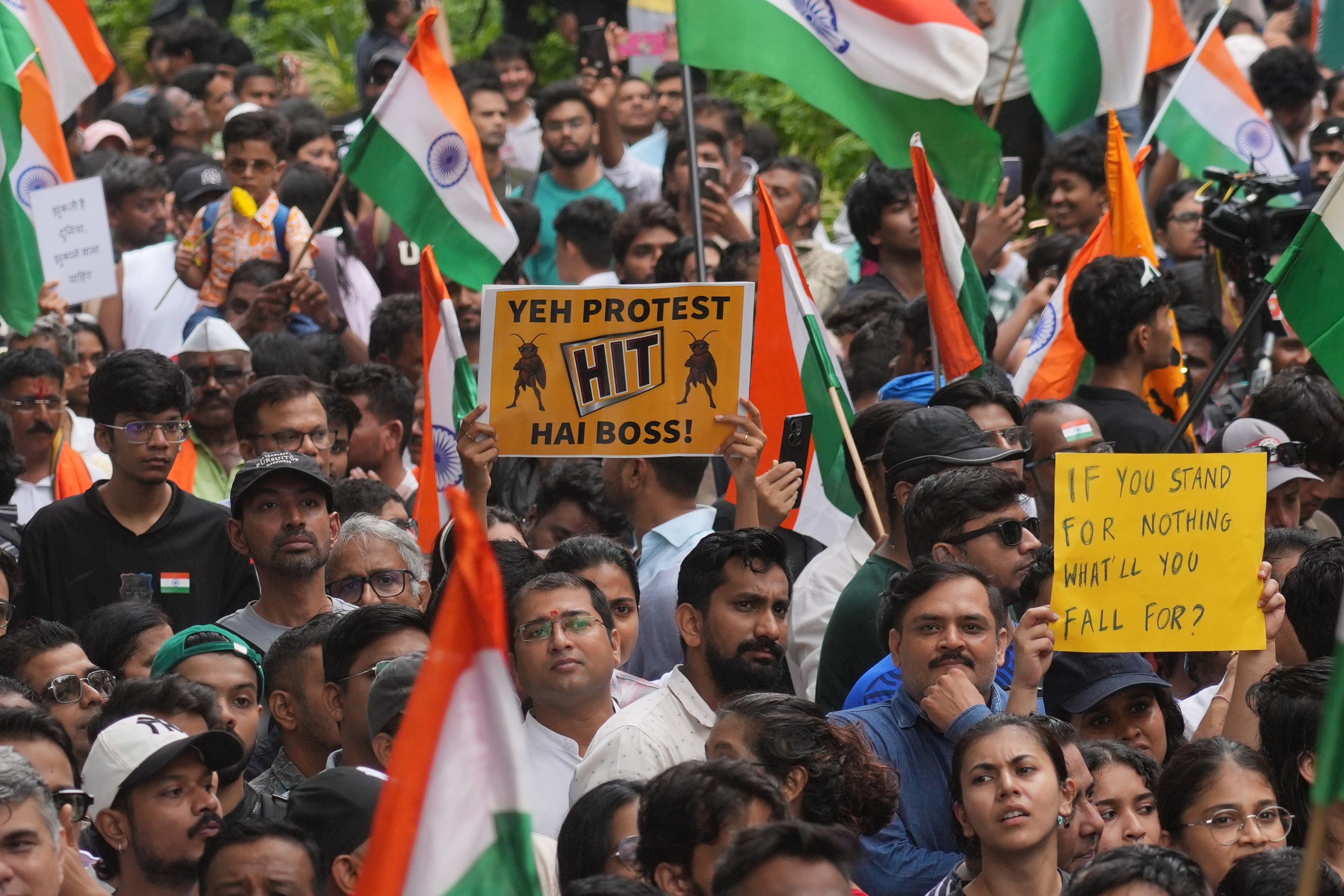 Protesters in Mumbai, India, celebrate after the country’s education minister, Dharmendra Pradhan, resigned following nationwide protests over irregularities in the conduct of the national medical school admission exams, on July 26. Photo: AP
