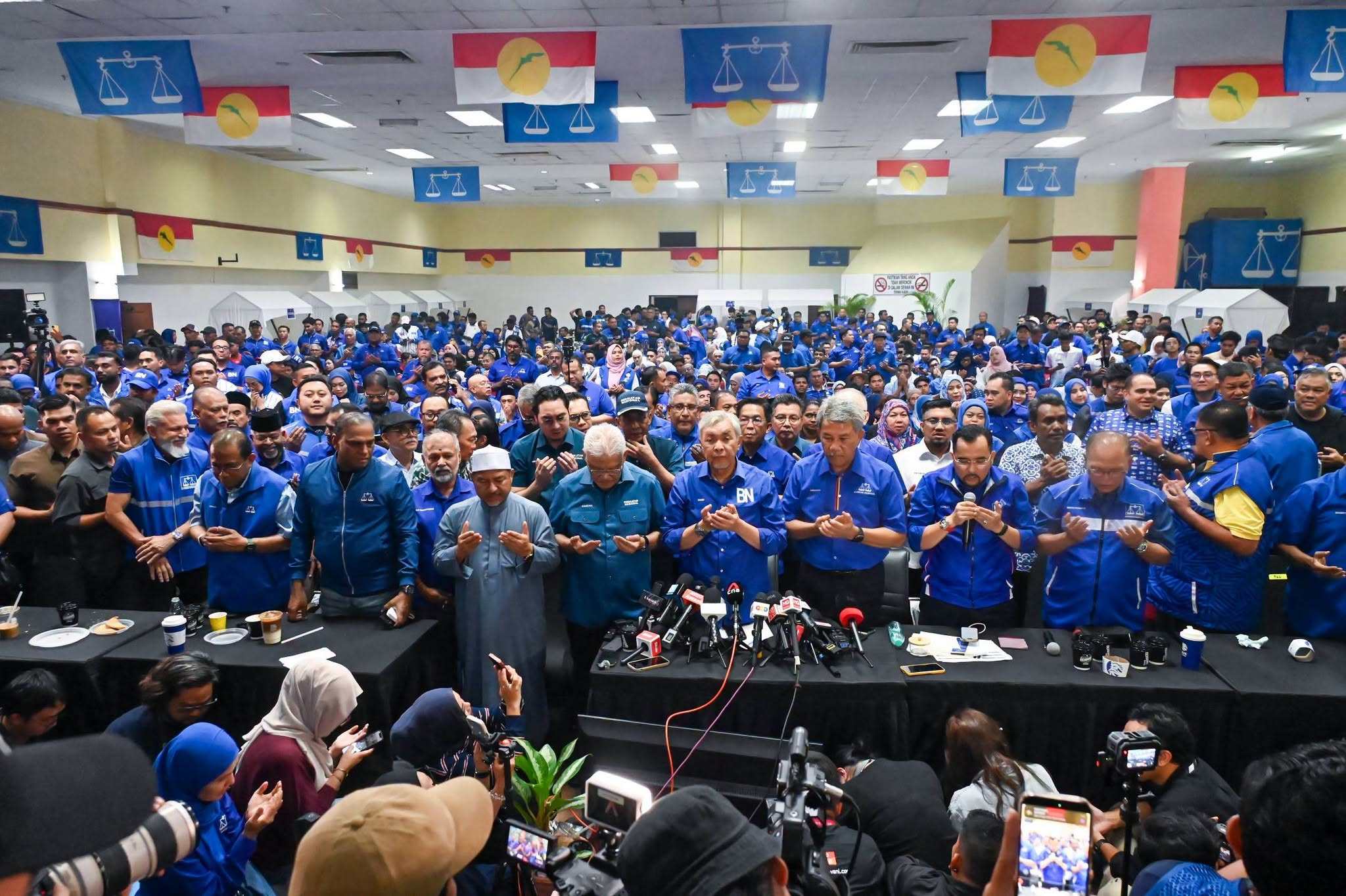 Umno members pray after the Negeri Sembilan election results on Saturday. Photo: Facebook/mediaumnomalaysia