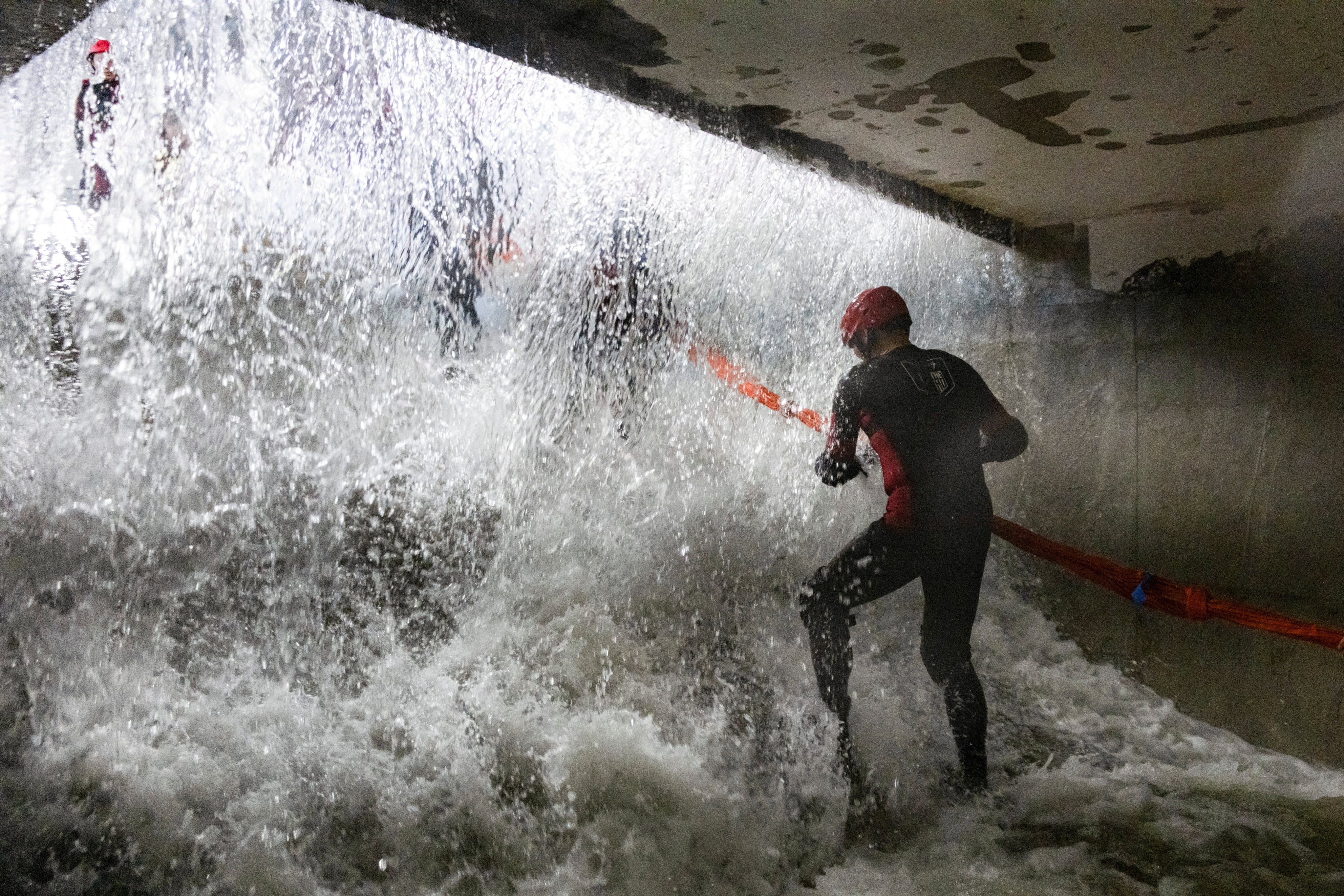 Participants practise evacuating an underground facility during a typhoon survival training session at the Lvxing Disaster Simulation Training Centre in Hangzhou, China. Photo: Reuters