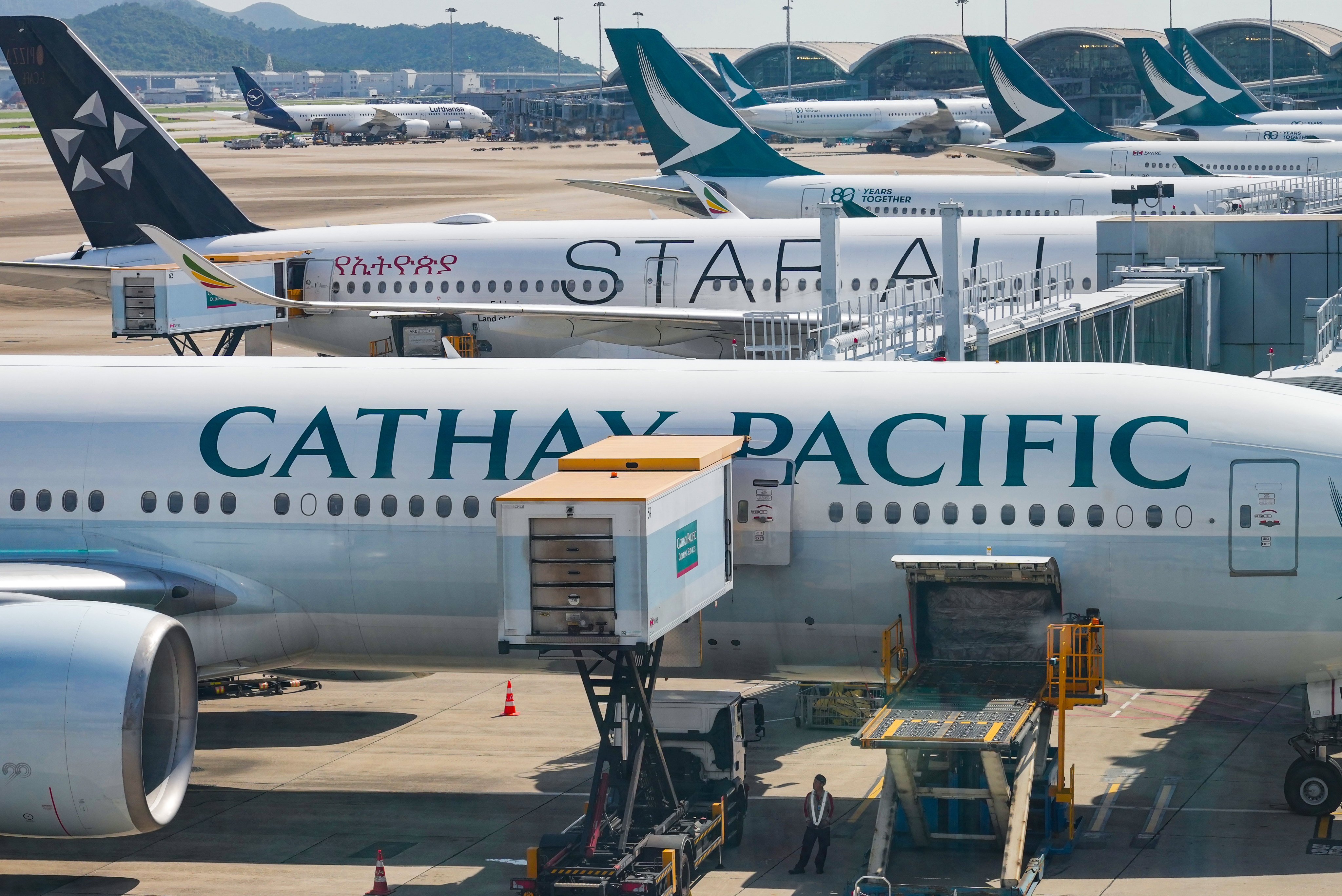 Cathay Pacific planes (front and back) at Hong Kong International Airport. Photo: May Tse