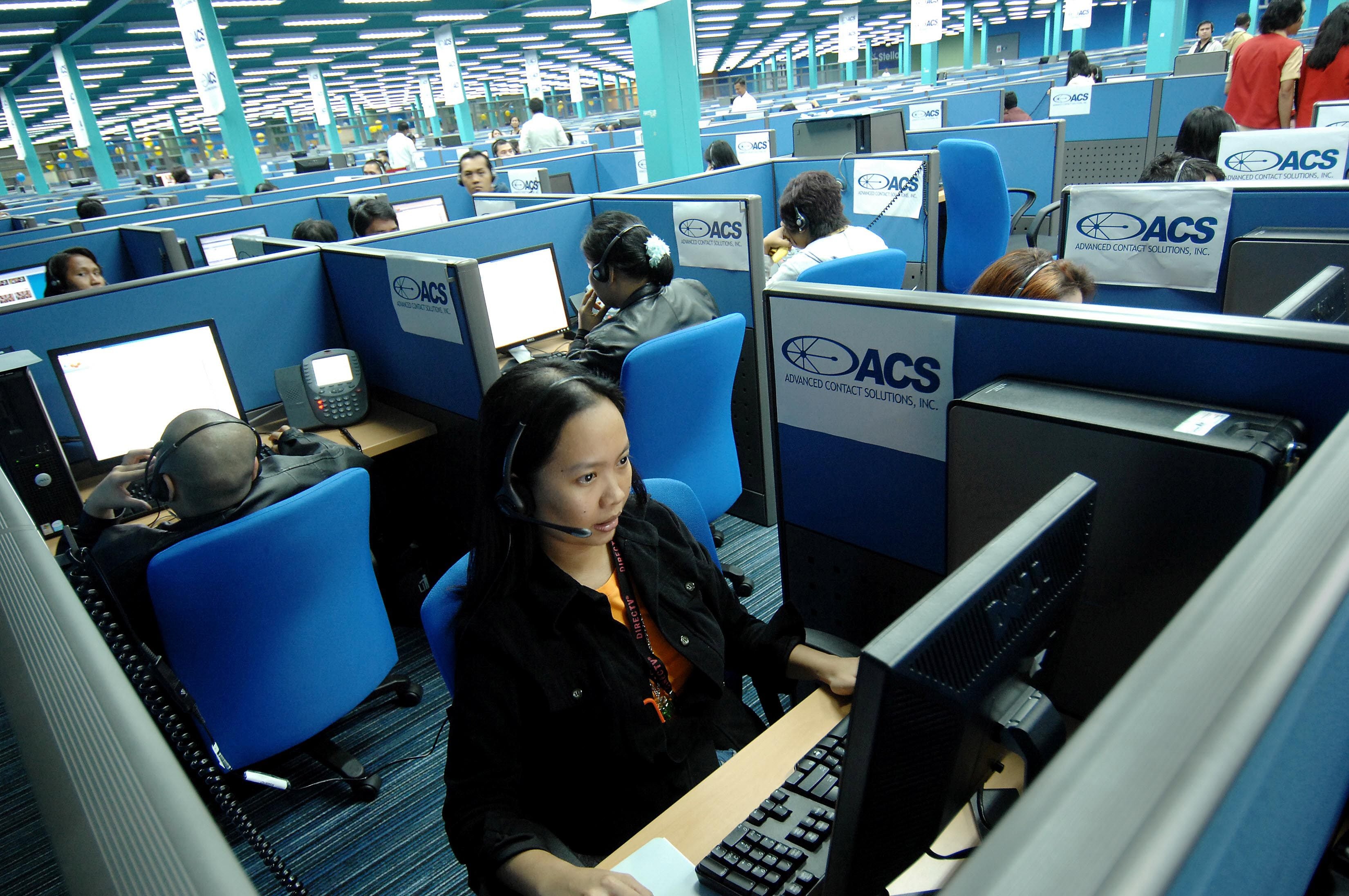 Filipino call centre agents attend to US clients at a call centre facility in Quezon city in 2007. Photo: AFP