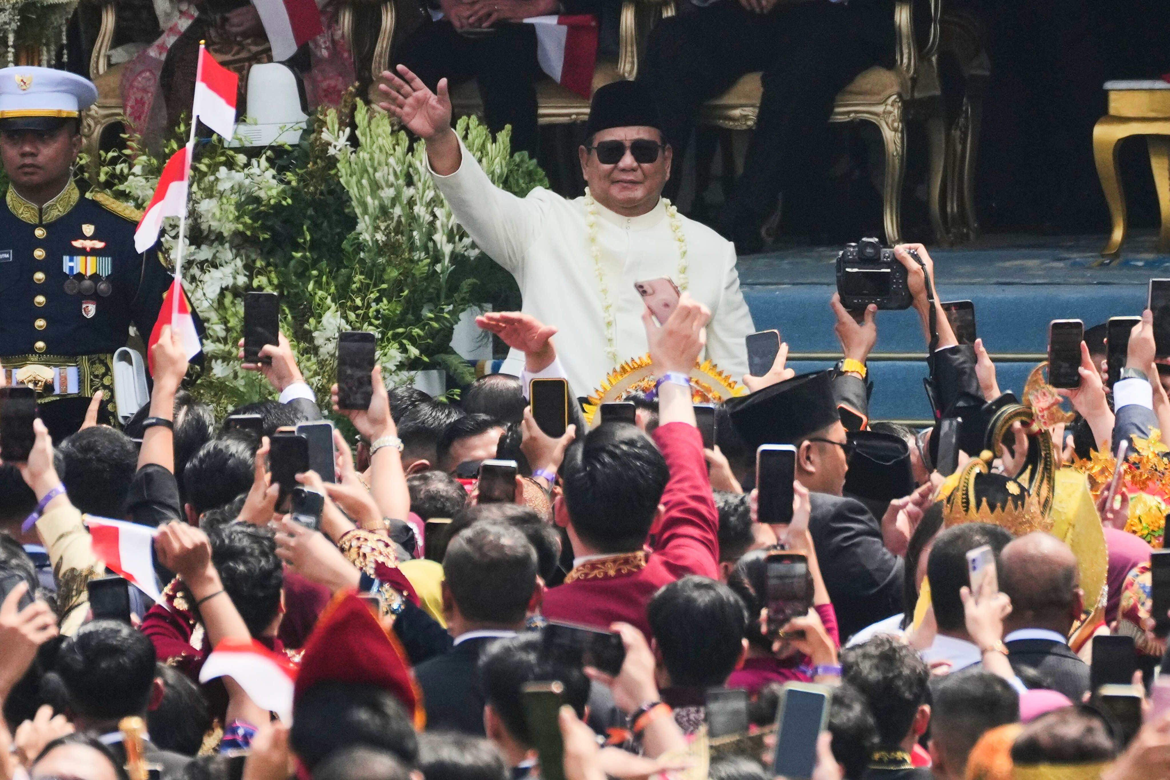 Indonesian President Prabowo Subianto waves at the crowd during a ceremony marking the 80th anniversary of the country’s independence at Merdeka Palace in Jakarta on August 17 last year. Photo: AP