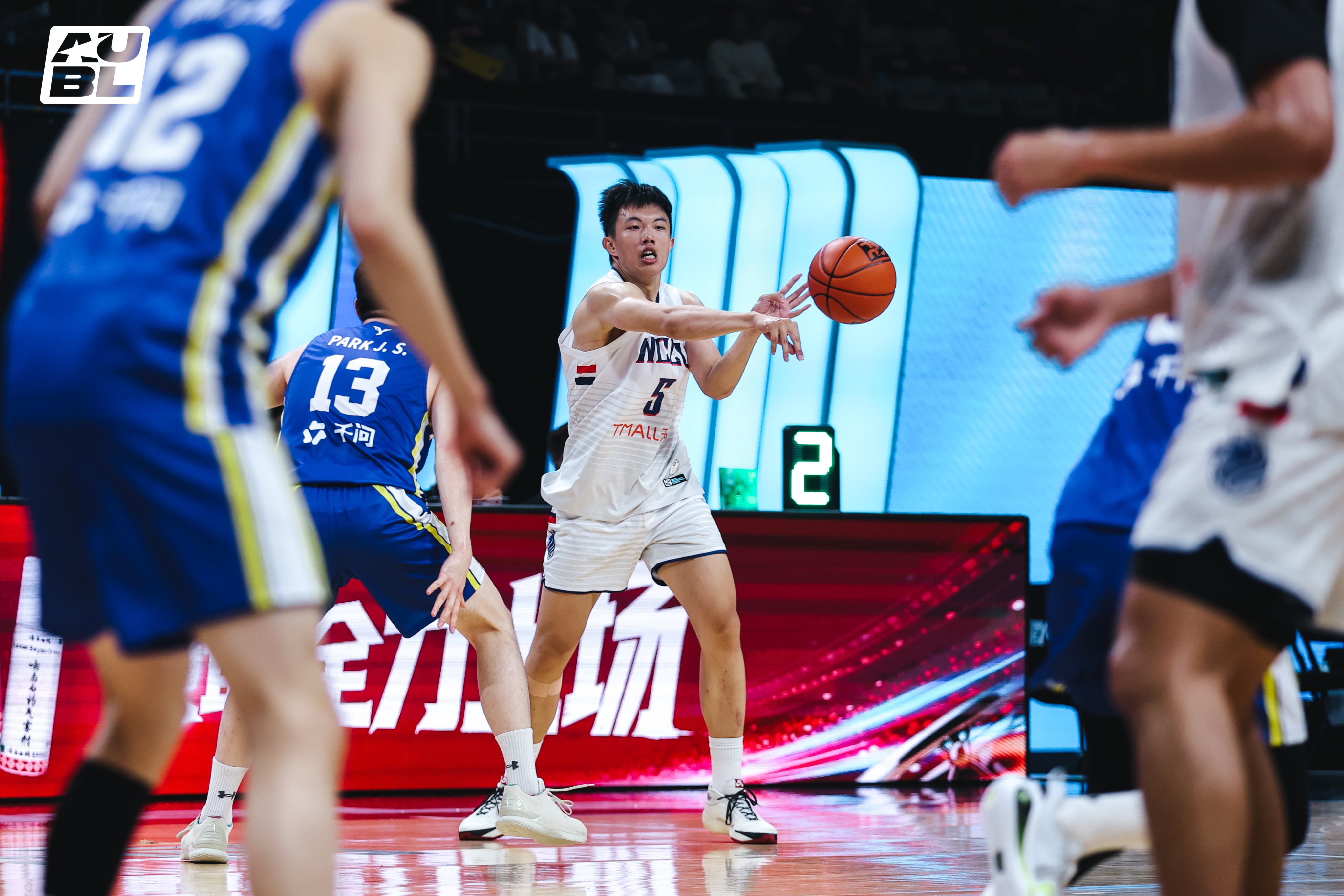 National Chengchi University’s Chen Chun-wei (centre) finished the game with nine points and eight rebounds. Photo: AUBL