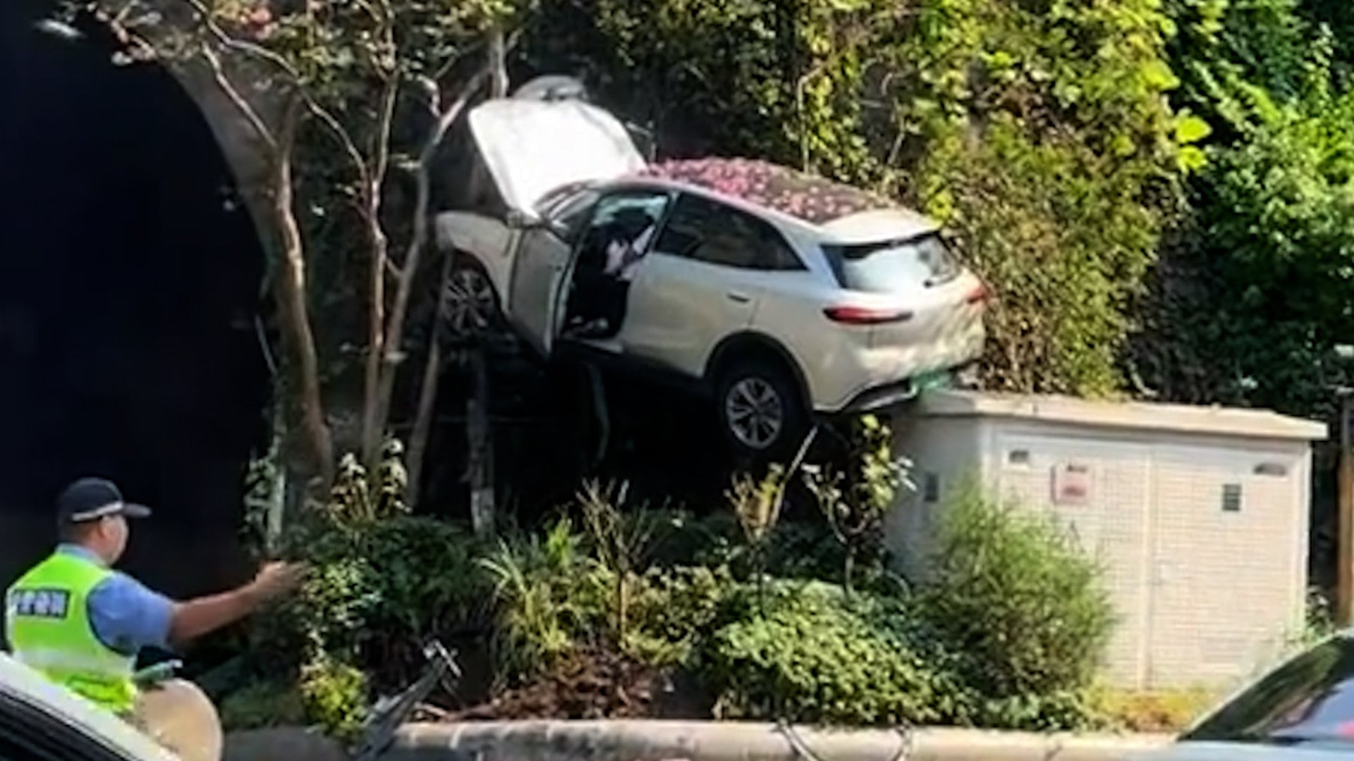 Car stuck on roadside slope in China