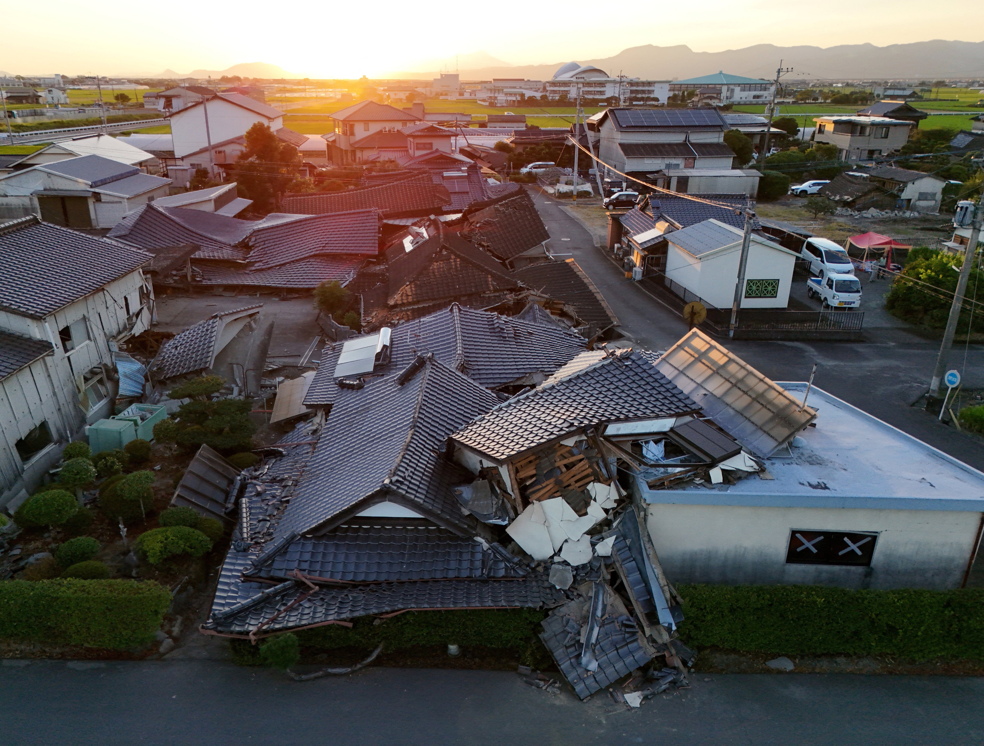 An aerial view of collapsed houses in the aftermath of an earthquake in Japan’s Kumamoto prefecture on July 31. Photo: Reuters