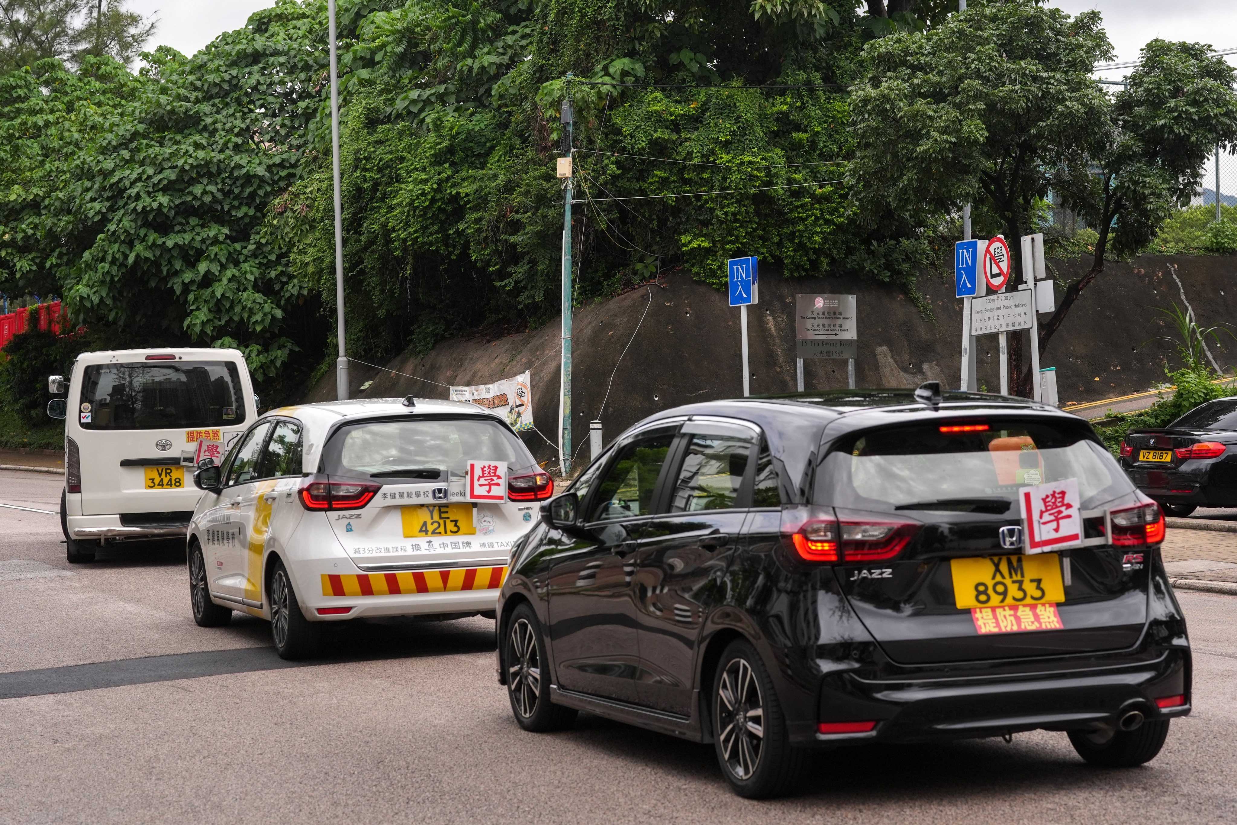 Driving lessons are in progress in Kowloon City  learners have their on-road driving lessons with tutors at Tin Kwong Road, Kowloon City. The Transport Department announced in April that applications would open in May for 332 new licences for private driving instructors. 13JUN26 SCMP / Elson Li