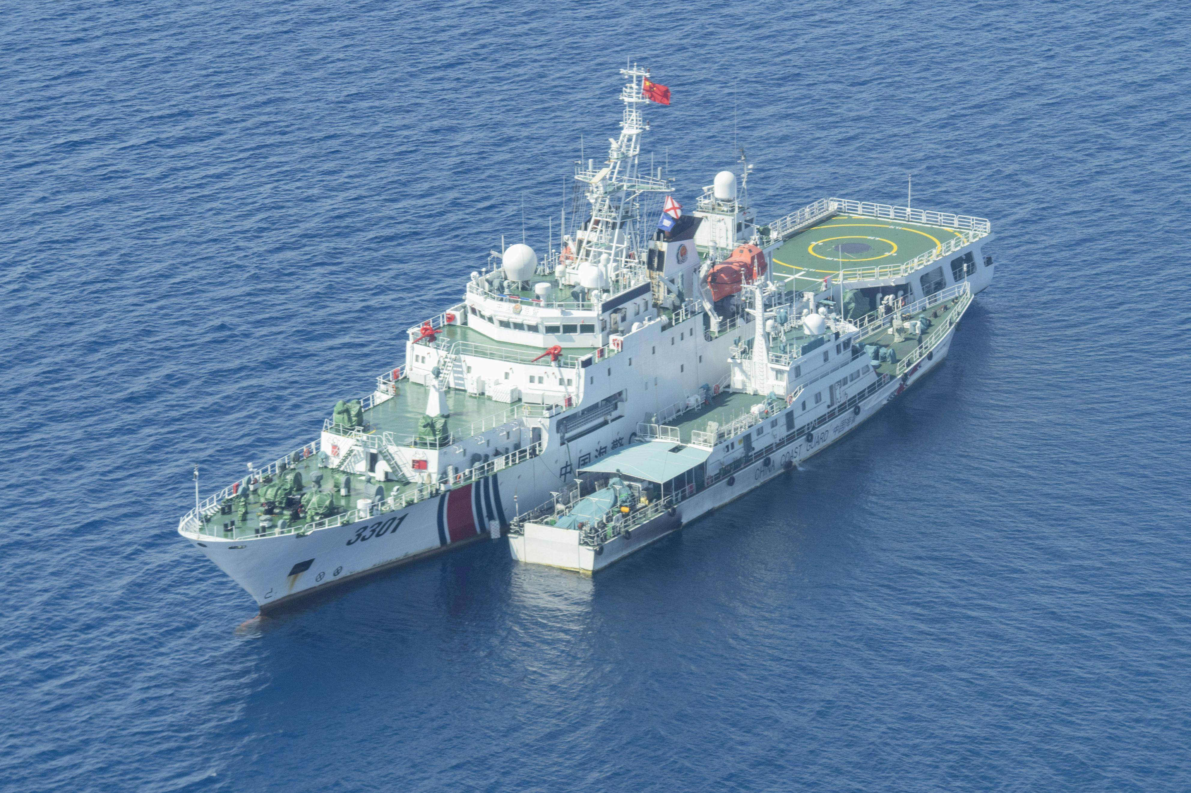 A China coastguard ship sails near Scarborough Shoal in the South China Sea on June 18. Photo: Kyodo
