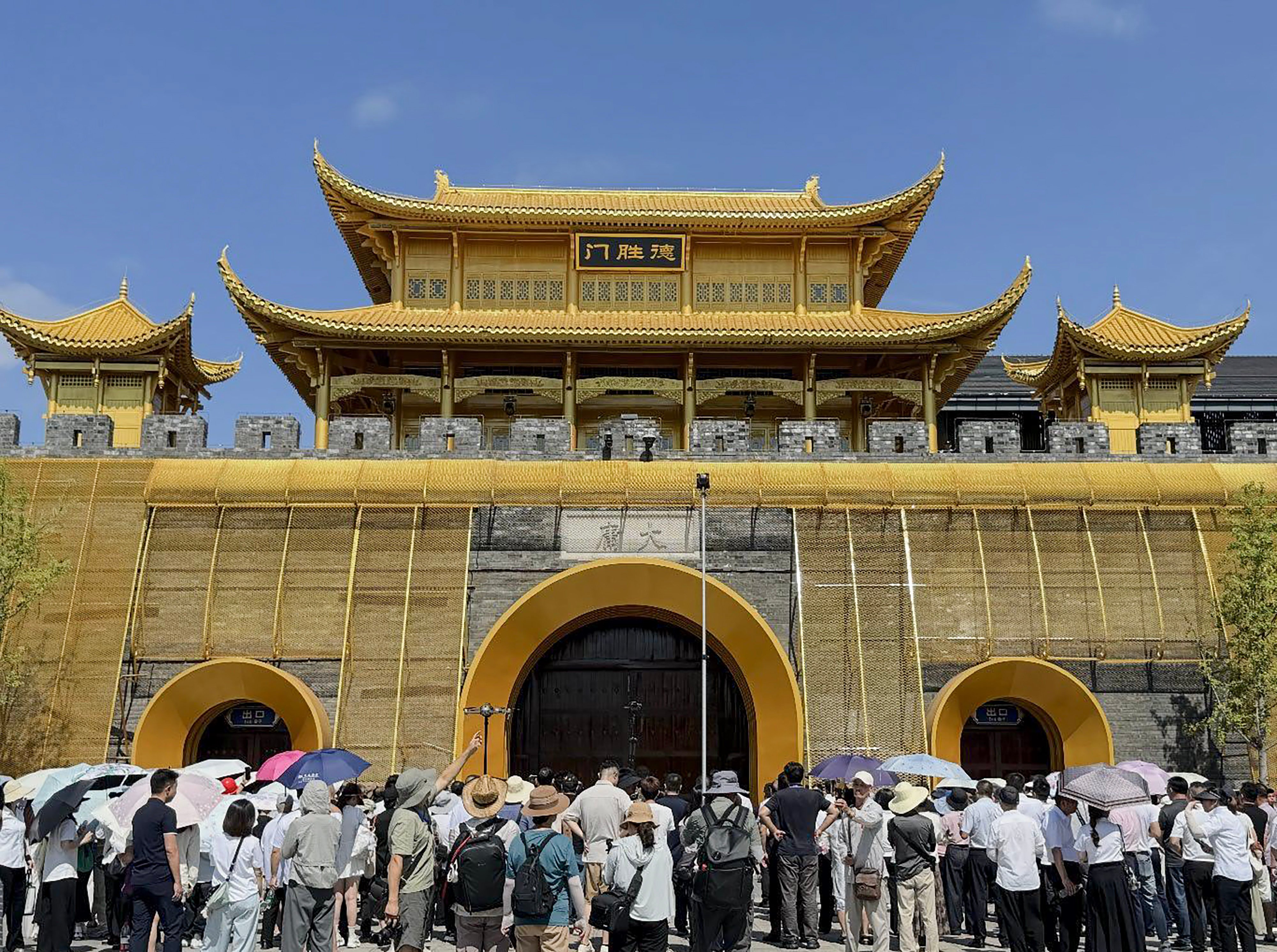 People await entry into Dayong Ancient City during its reopening last month. Photo: Handout