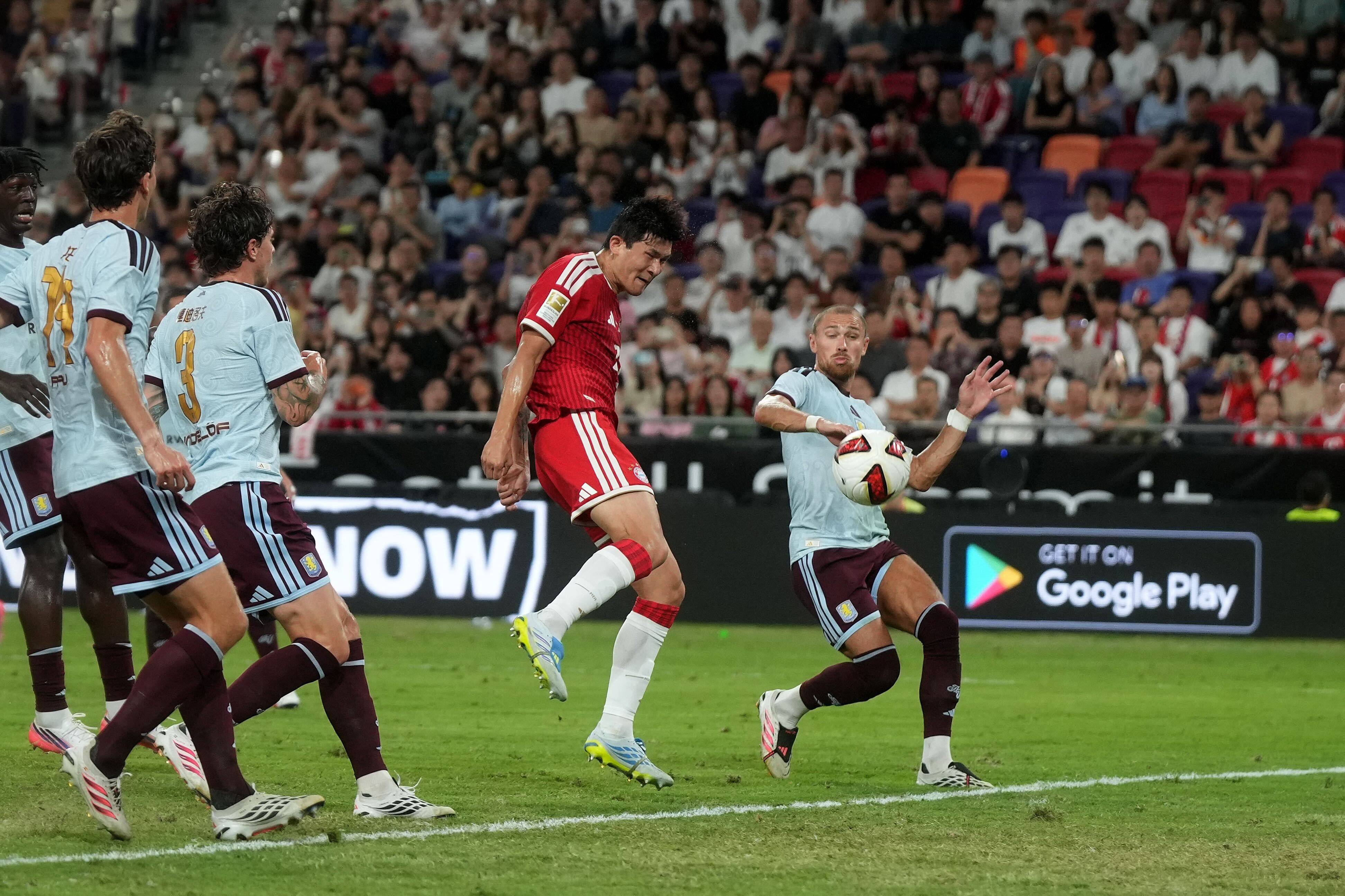 South Korean defender Kim Min-jae (middle) heads in Bayern Munich's first goal against Aston Villa in the Audi Football Summit match at Kai Tak Stadium on Friday. Photo: Elson Li