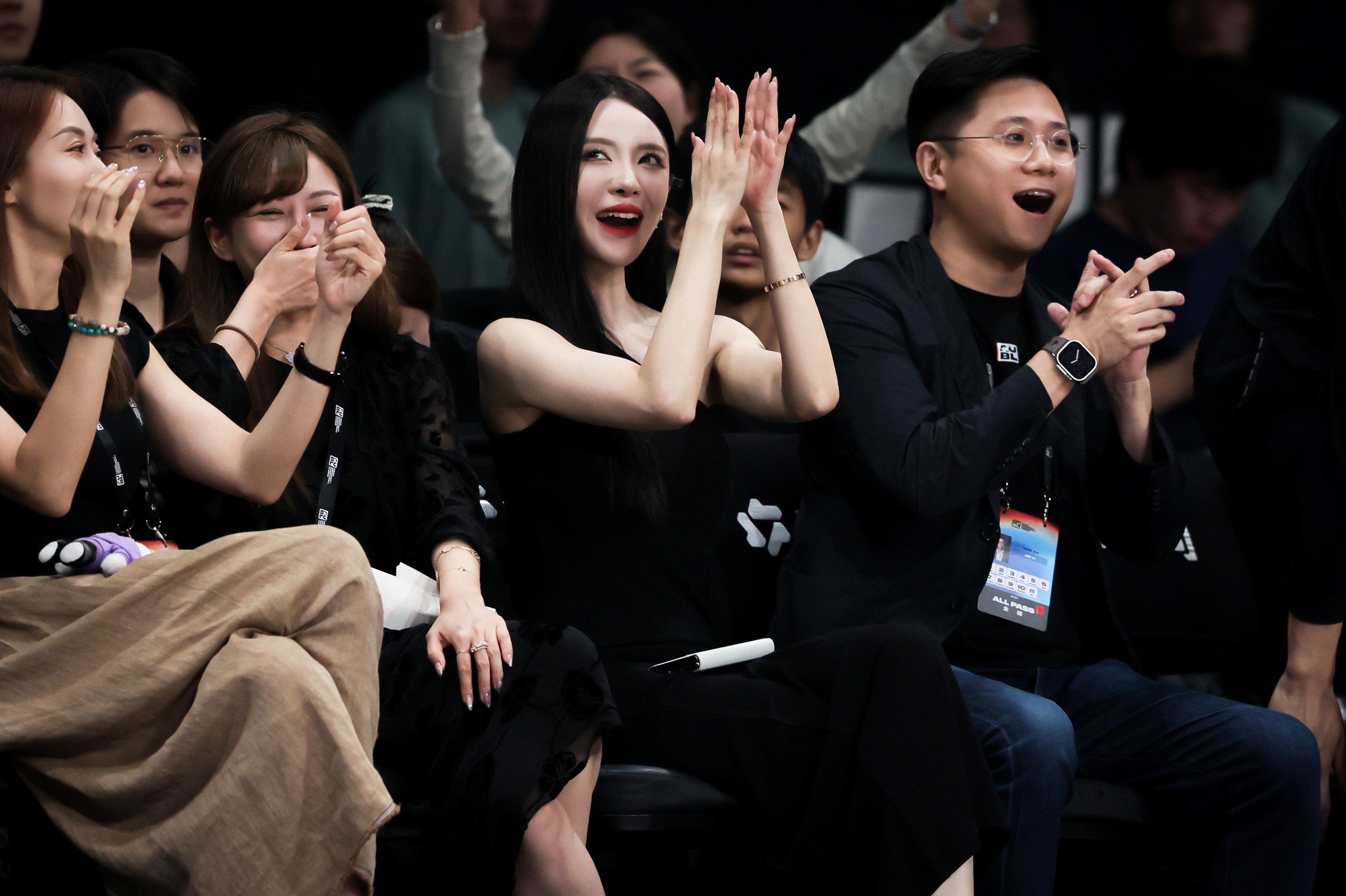 Asian University Basketball League CEO Jay Li Jintian (right) watching a match at Binjiang Gymnasium this week. Photo: Handout