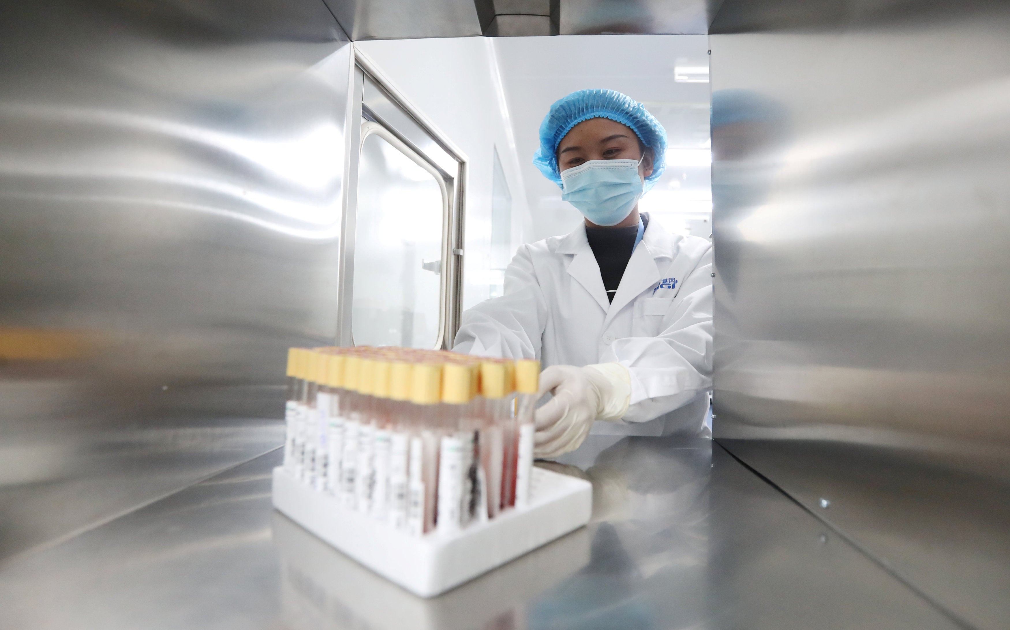 A technician works at a genetic testing laboratory of BGI, formerly known as Beijing Genomics Institute, in Kunming, Yunnan province. Photo: China Out/Reuters