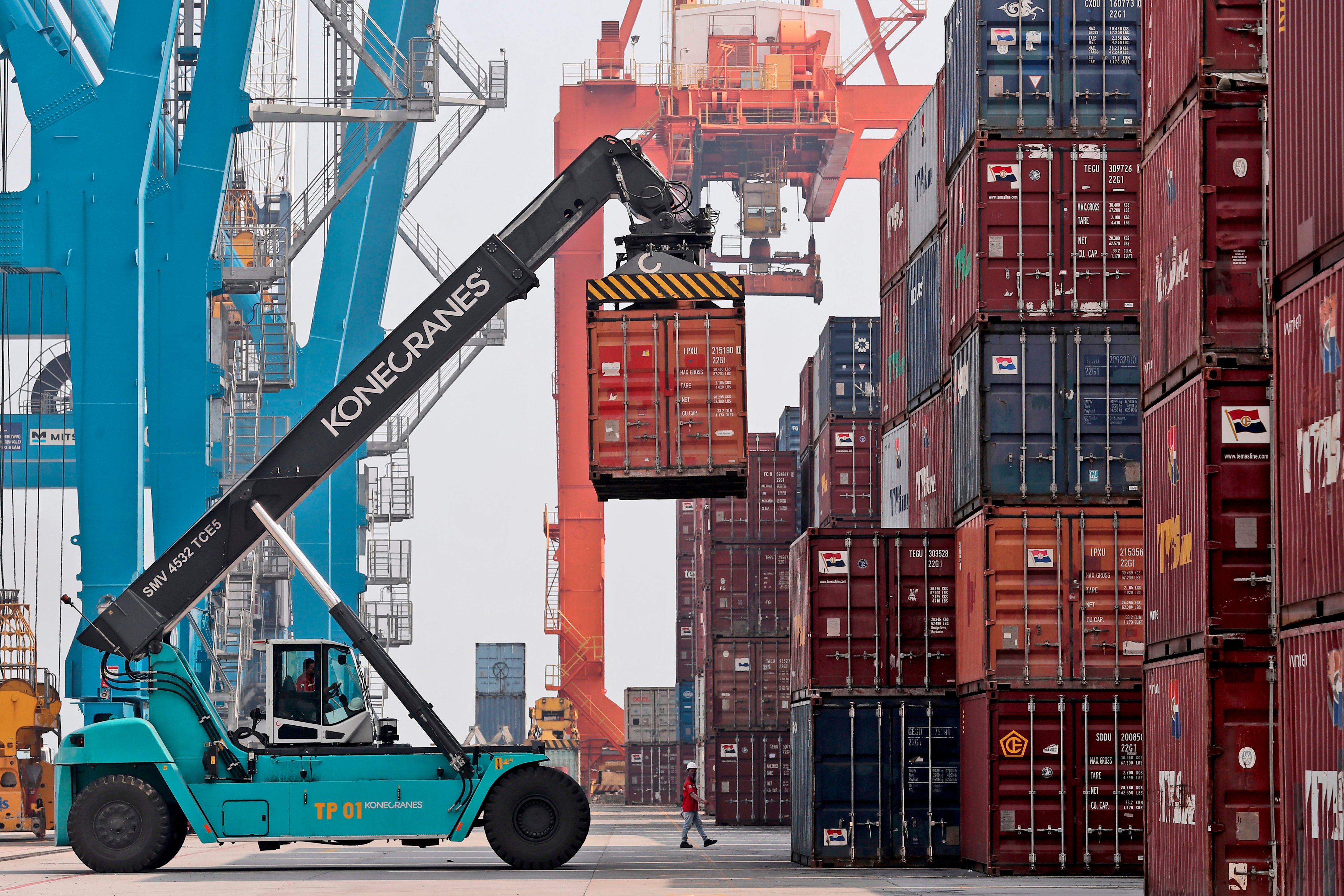 Containers being stacked at Tanjung Priok Port in Jakarta. Photo: AP