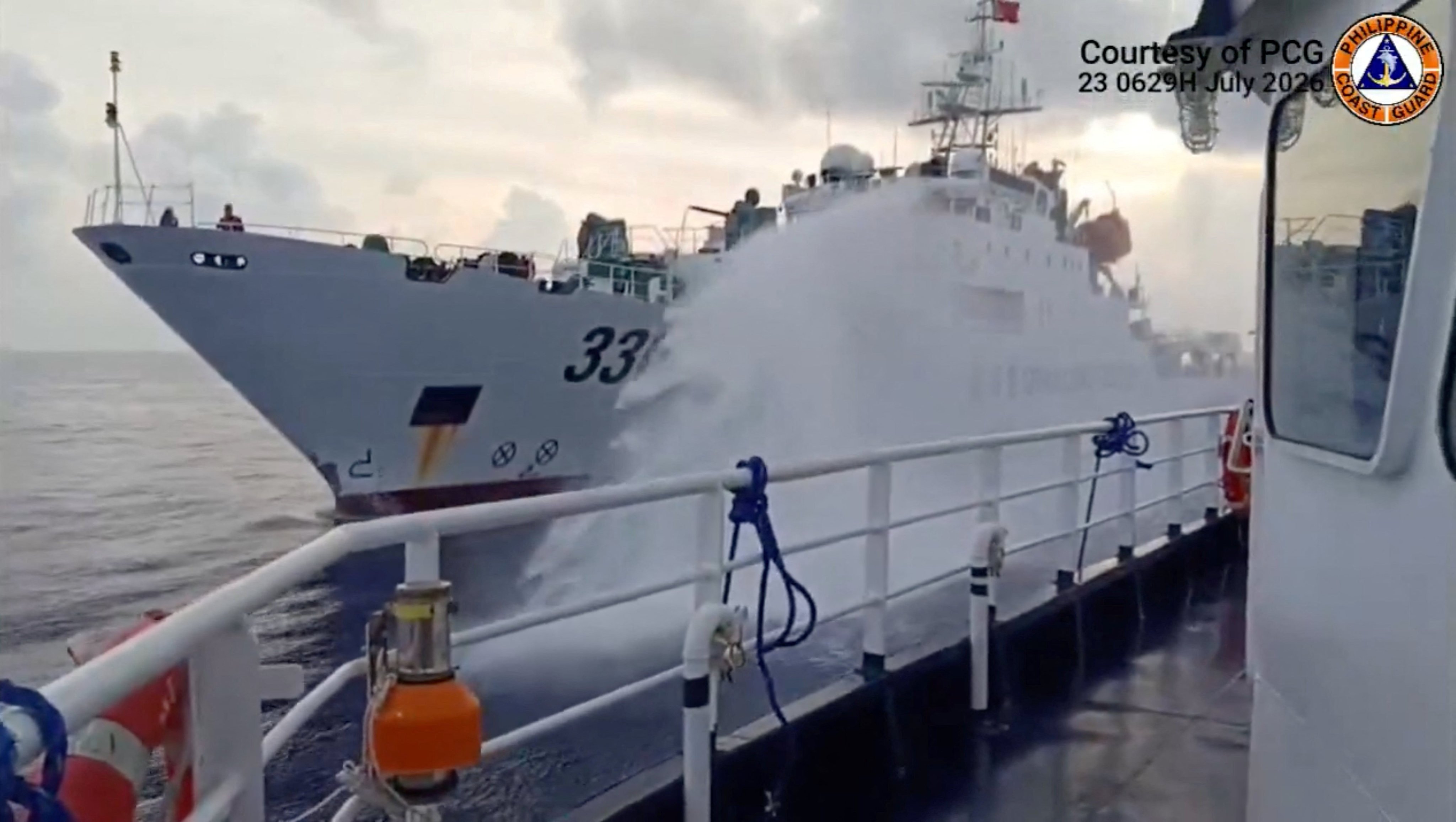 A Chinese coastguard ship fires a water cannon at a Philippine vessel in South China Sea, as seen in this screengrab of a video released on July 23. Photo: Jay Tarriela/X/Handout/Reuters