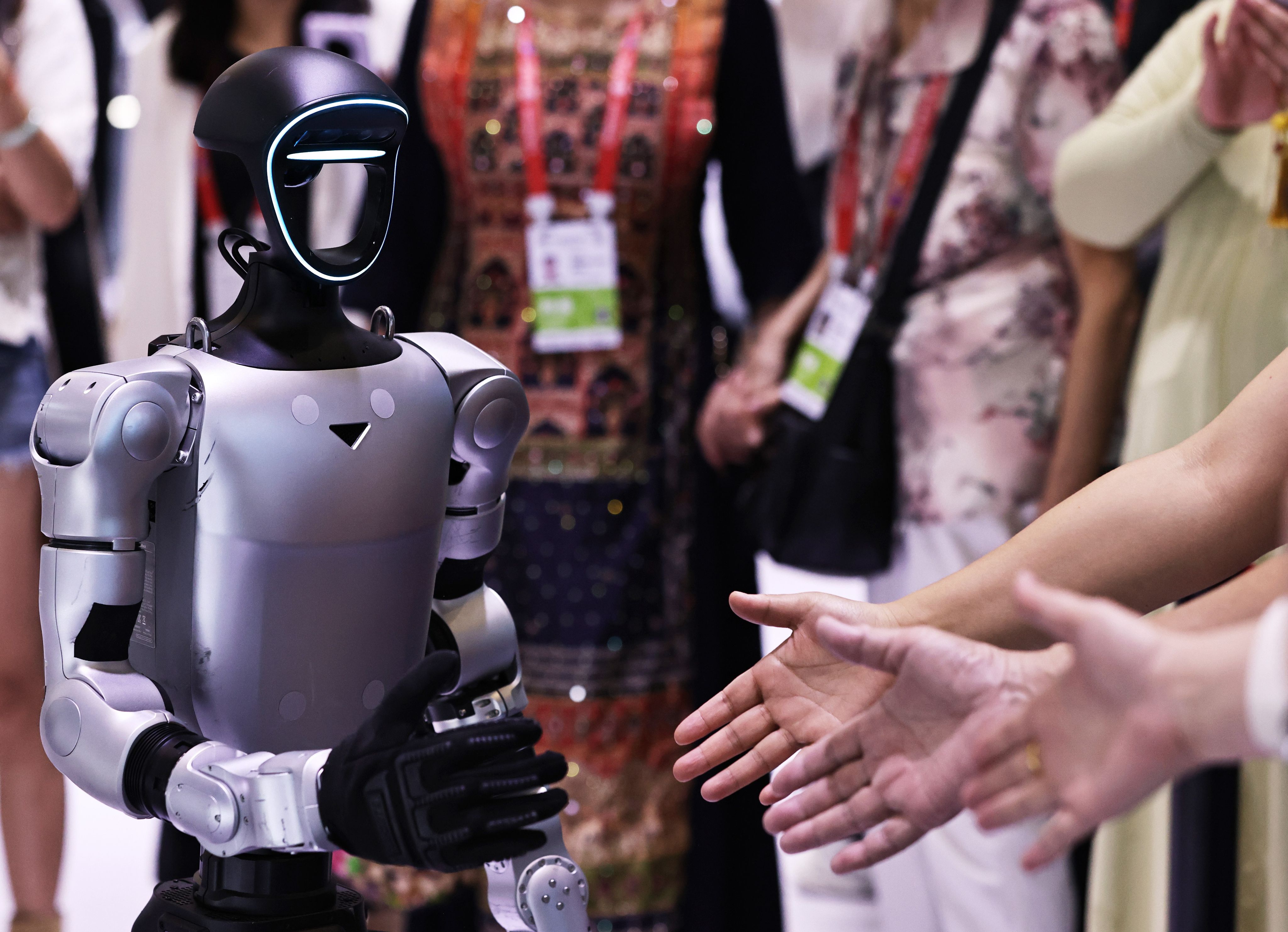 Visitors interact with a robot from Unitree Robotics during the China International Consumer Products Expo in Haikou, south China’s Hainan province, April 14, 2026. Photo: Xinhua