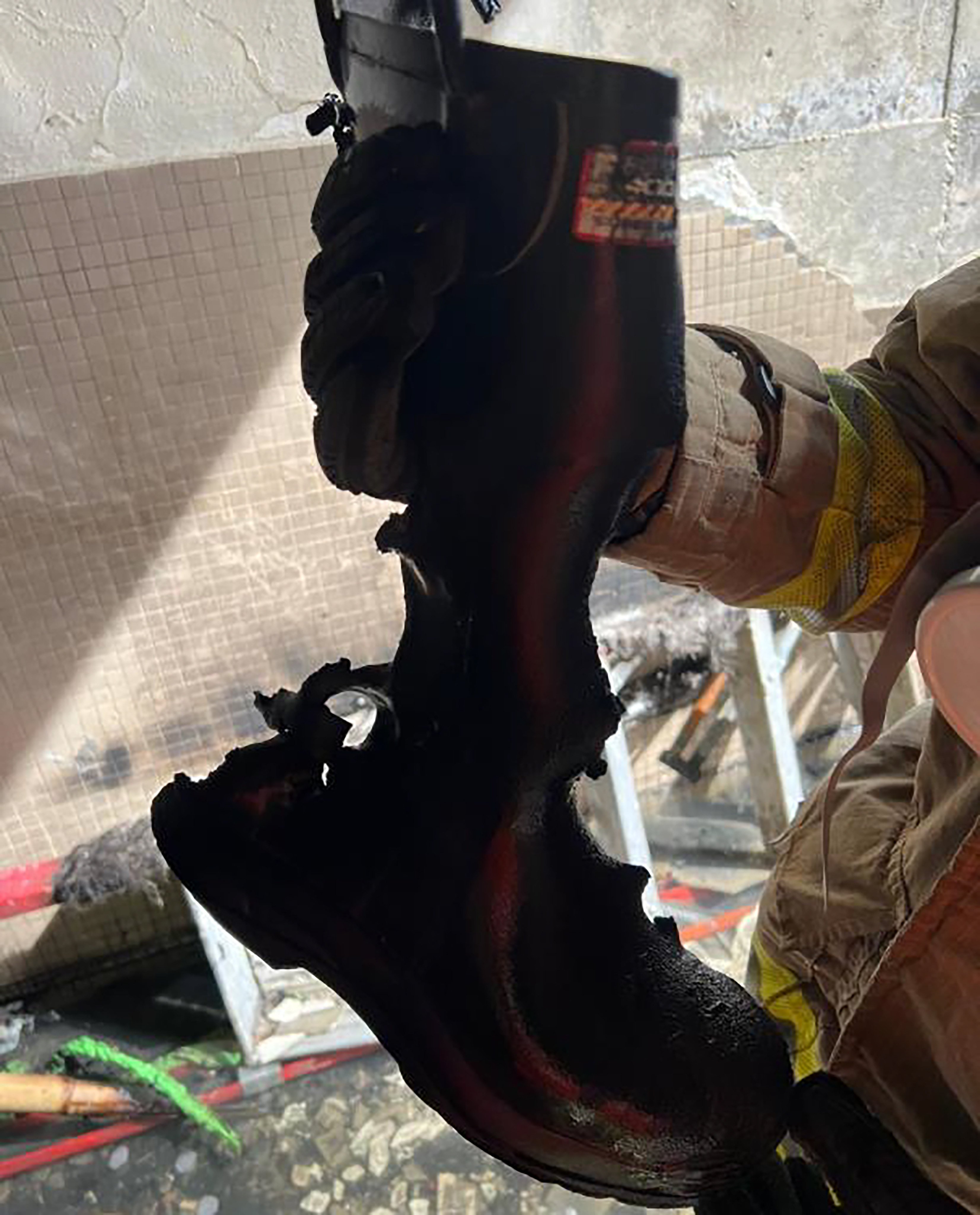 Ho Wai-ho’s rubber boots might have also been in prolonged contact with hot or burning objects, according to the report. Photo: Interim Investigation Report of Inter-departmental Fire Investigation Task Force