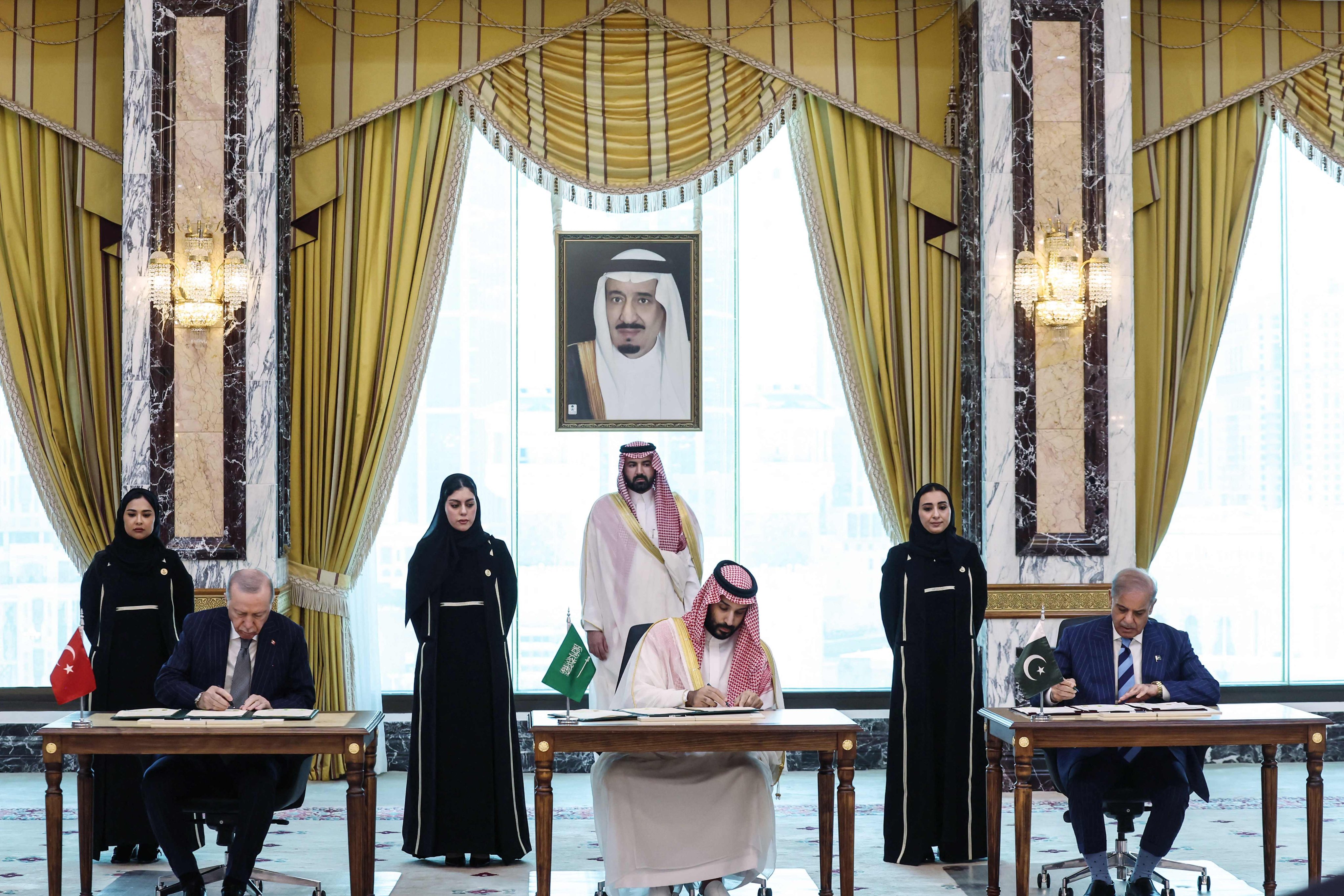 Saudi Arabia’s Crown Prince Mohammed bin Salman (centre), flanked by Turkey’s President Recep Tayyip Erdogan (left) and Pakistan’s Prime Minister Shehbaz Sharif, signing a joint defence agreement in Mecca on Friday. Photo: Turkish Presidency Press Office/AFP