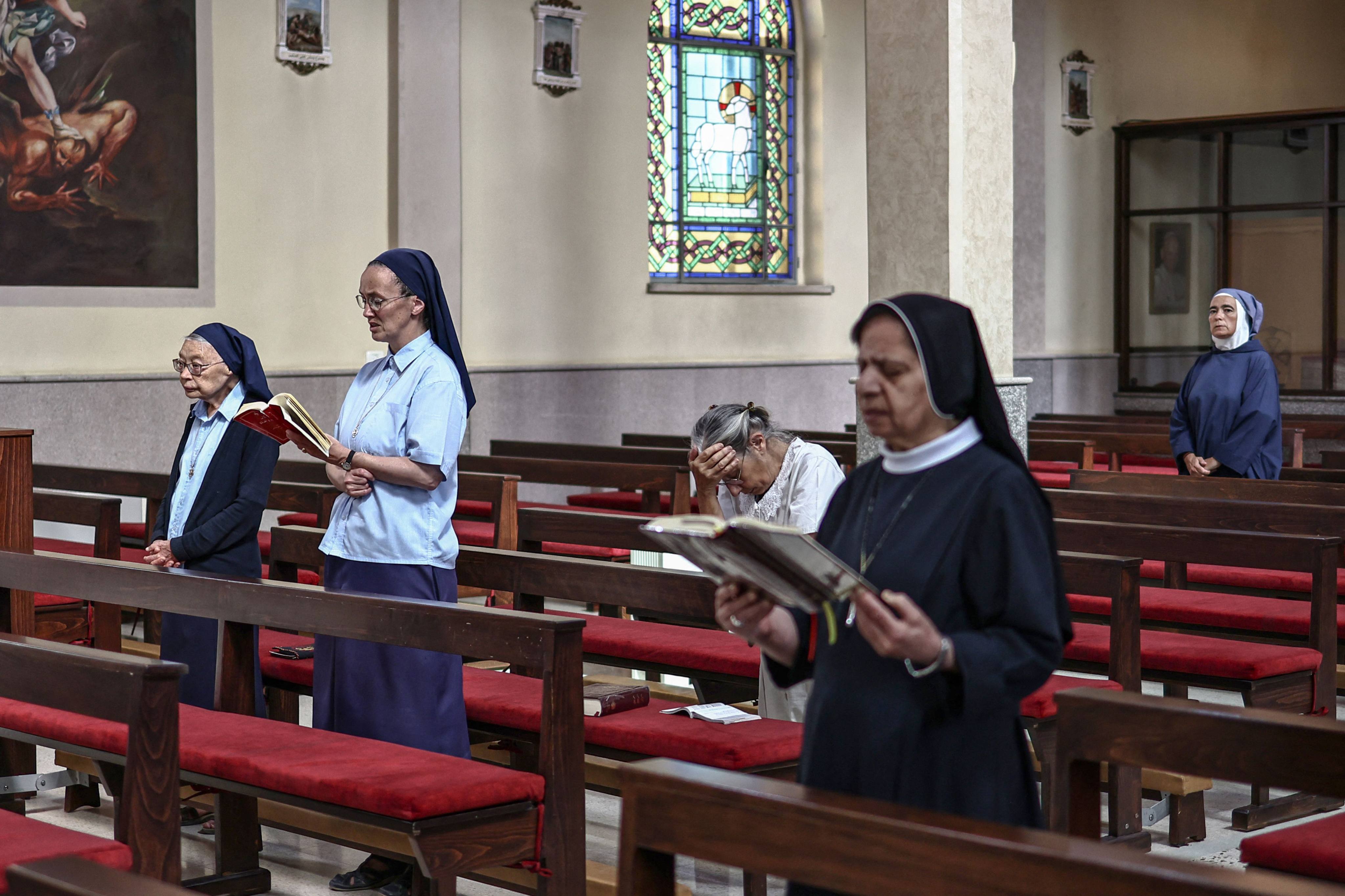 Catholic nuns and Christian worshippers attend mass at the Latin Monastery (Deir al-Latin) in the Palestinian Christian town of Taybeh in the Israeli-occupied West Bank. Photo: AFP