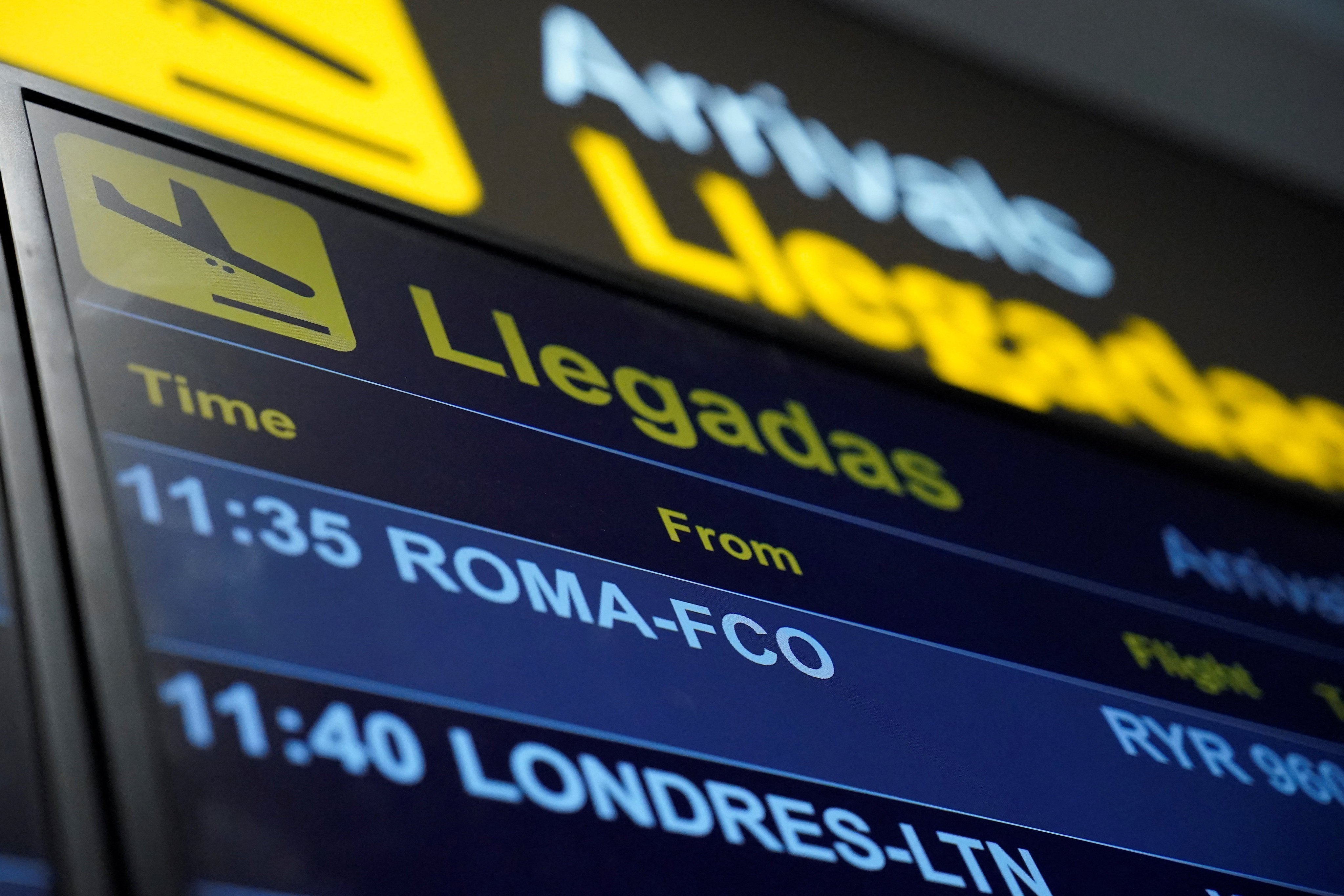 An information panel displays flight details on Saturday at Adolfo Suarez Madrid–Barajas Airport, as Spain’s government said it would establish border controls for flights and ships from Italy. Photo: Reuters