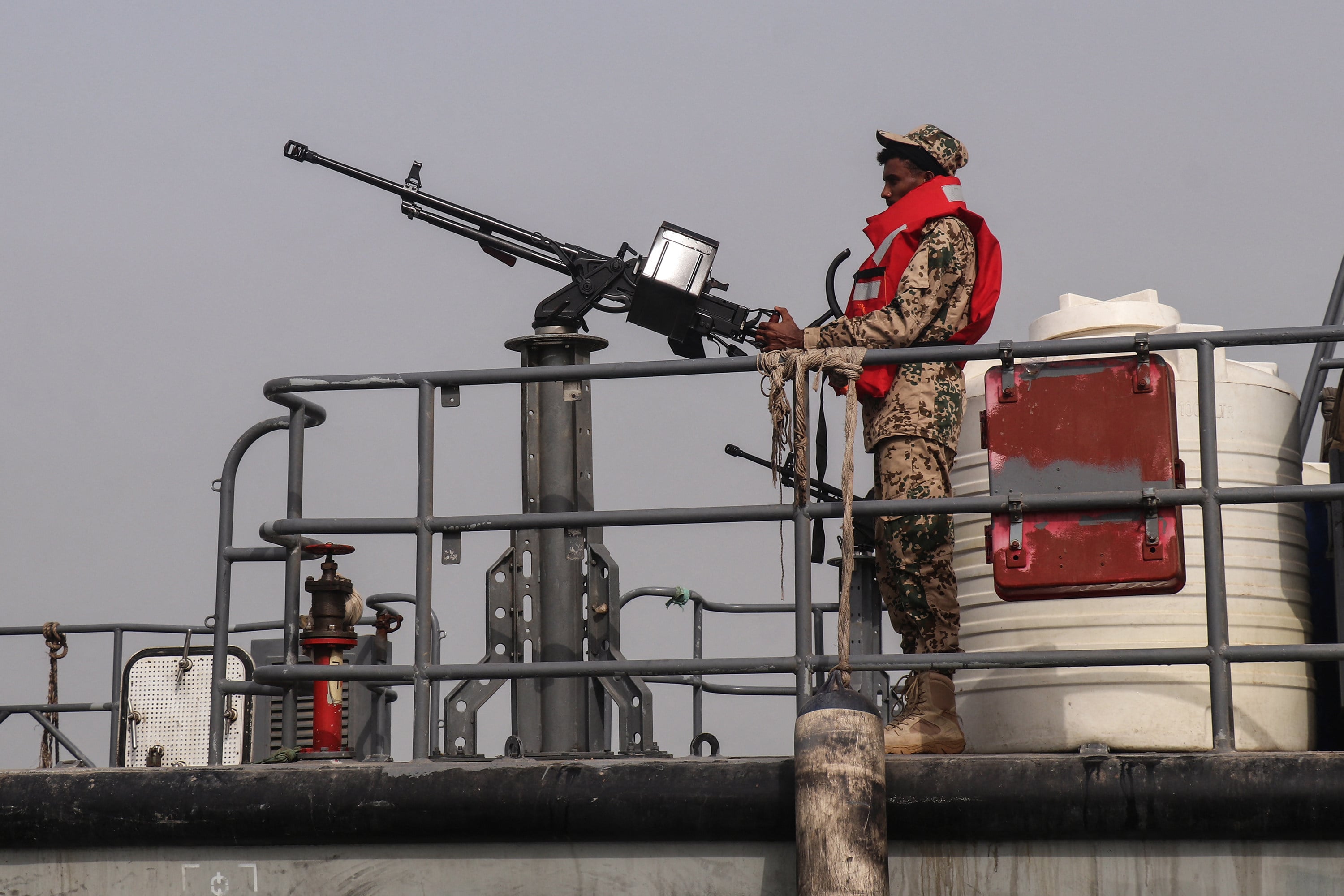 A sailor from the navy of Yemen’s Aden-based government stands on board a vessel patrolling a shipping lane off The Hanish Islands in the Red Sea in July. Photo: TNS