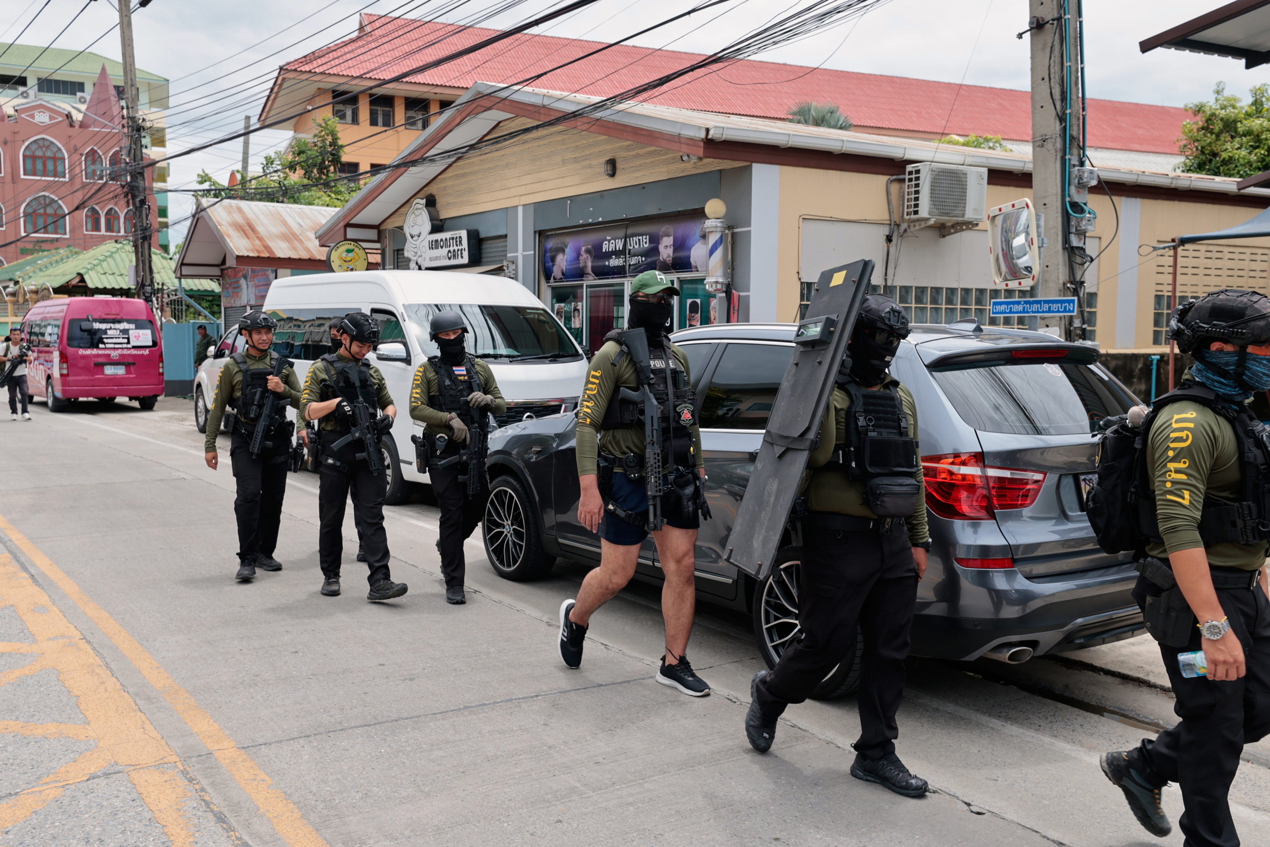 Policemen patrol outside the school in Thailand’s Nonthaburi province on Friday. Photo: AP