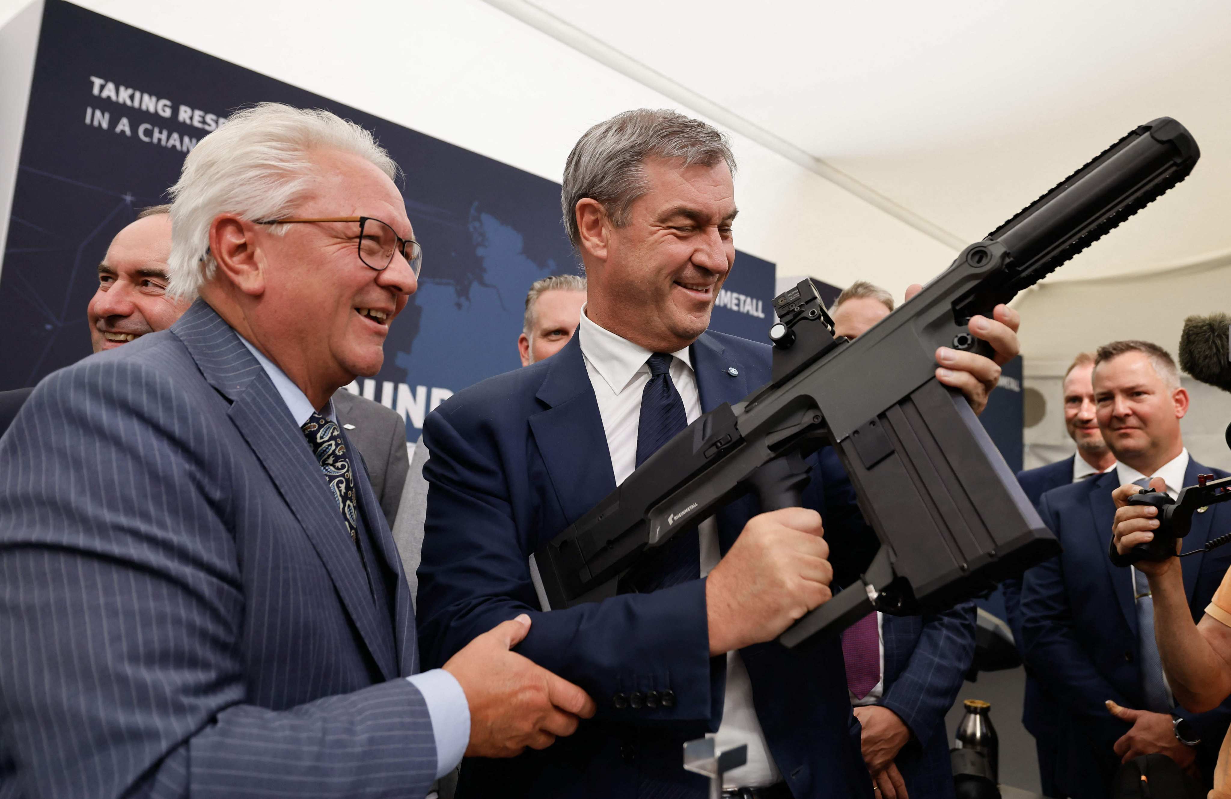 Bavaria’s state Premier Markus Soeder holds a grenade launcher as Rheinmetall’s CEO Armin Papperger (left) watches during a ceremony in southern Germany last month. Photo: AFP