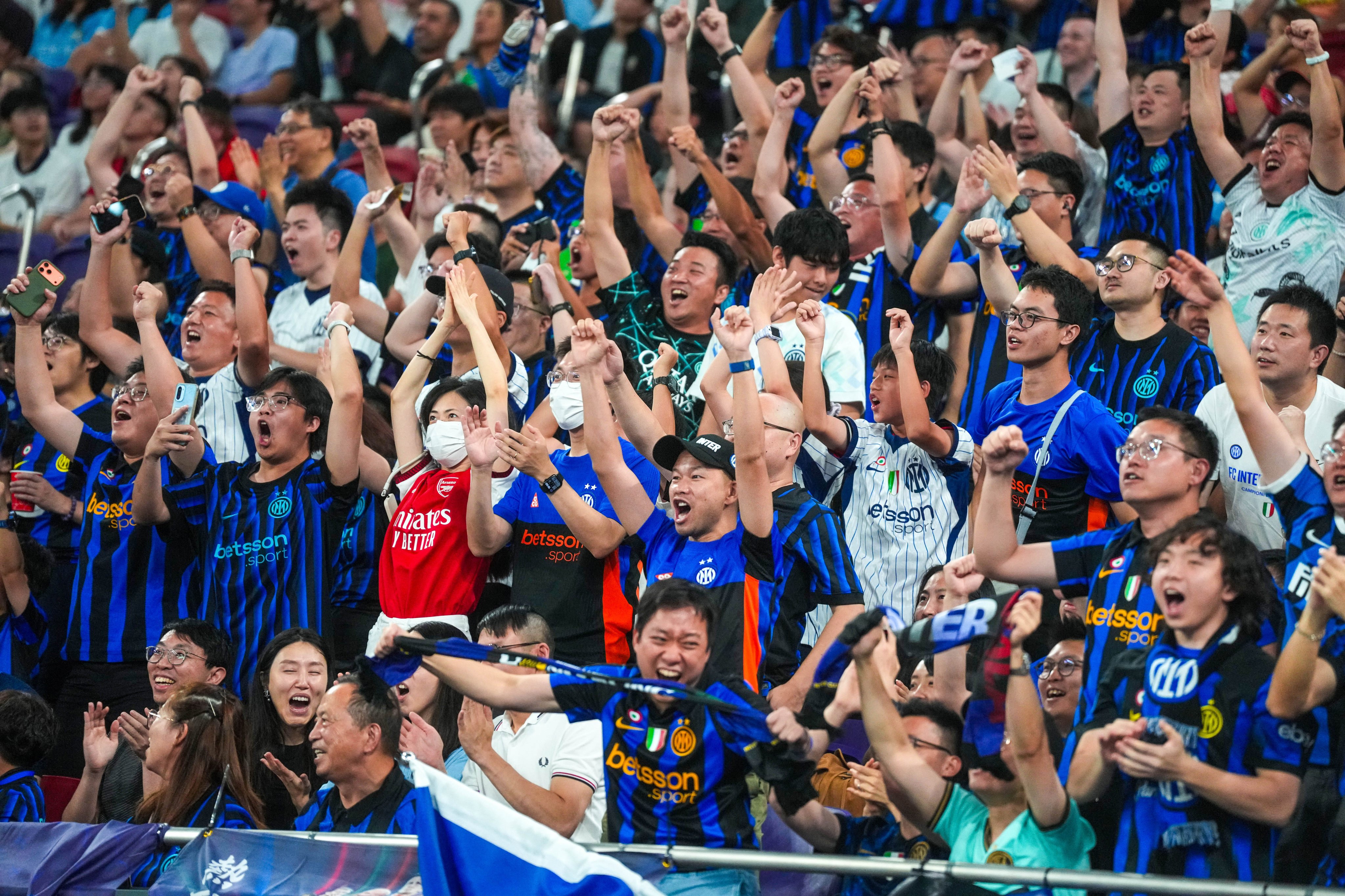 Fans of Inter Milan celebrate during the Hong Kong Football Festival friendly match against Manchester City at Kai Tak Stadium. Photo: Elson Li