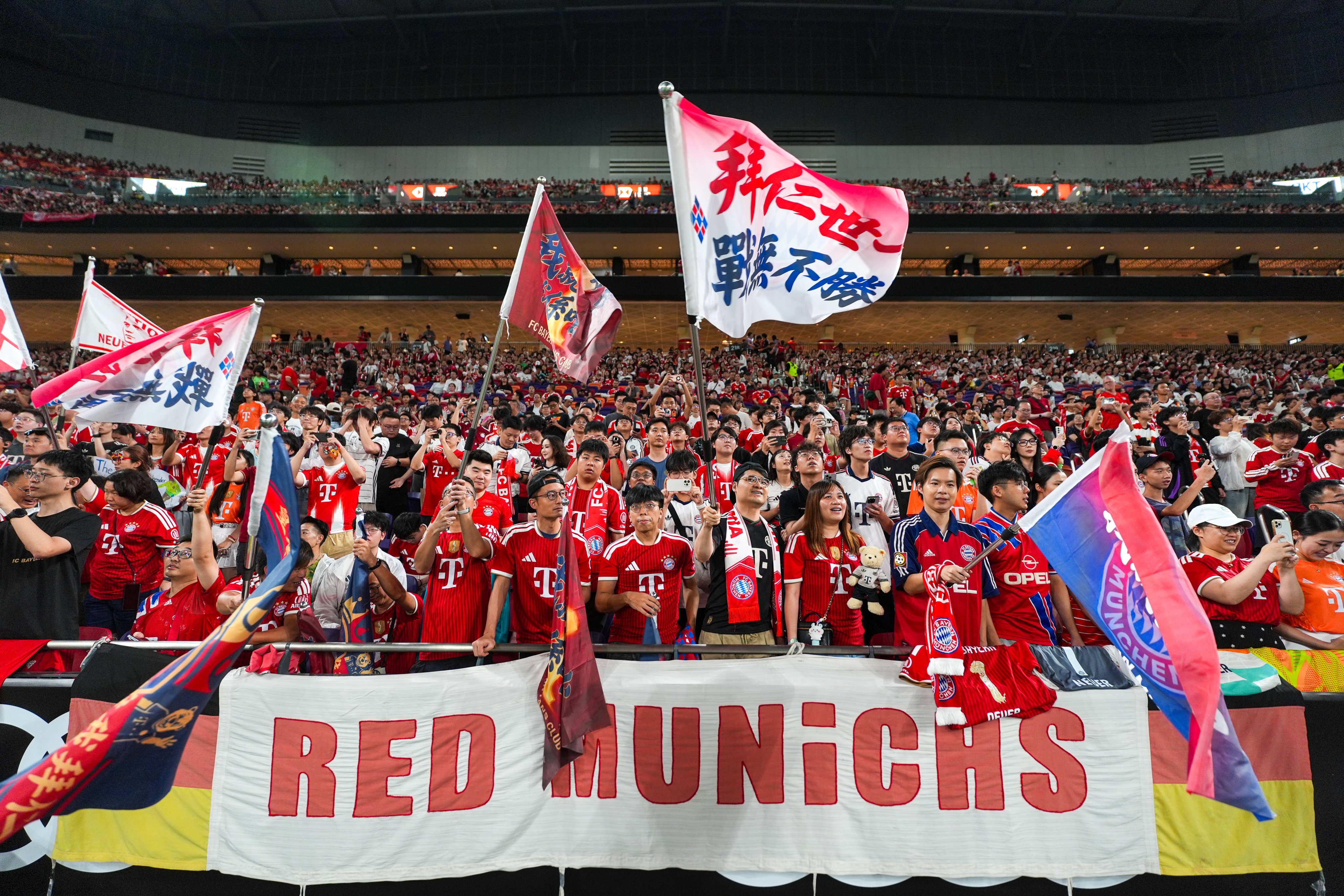 Fans of FC Bayern Munich cheer before a match against Aston Villa during the Audi Football Summit 2026 at Kai Tak Stadium. Photo: Elson Li