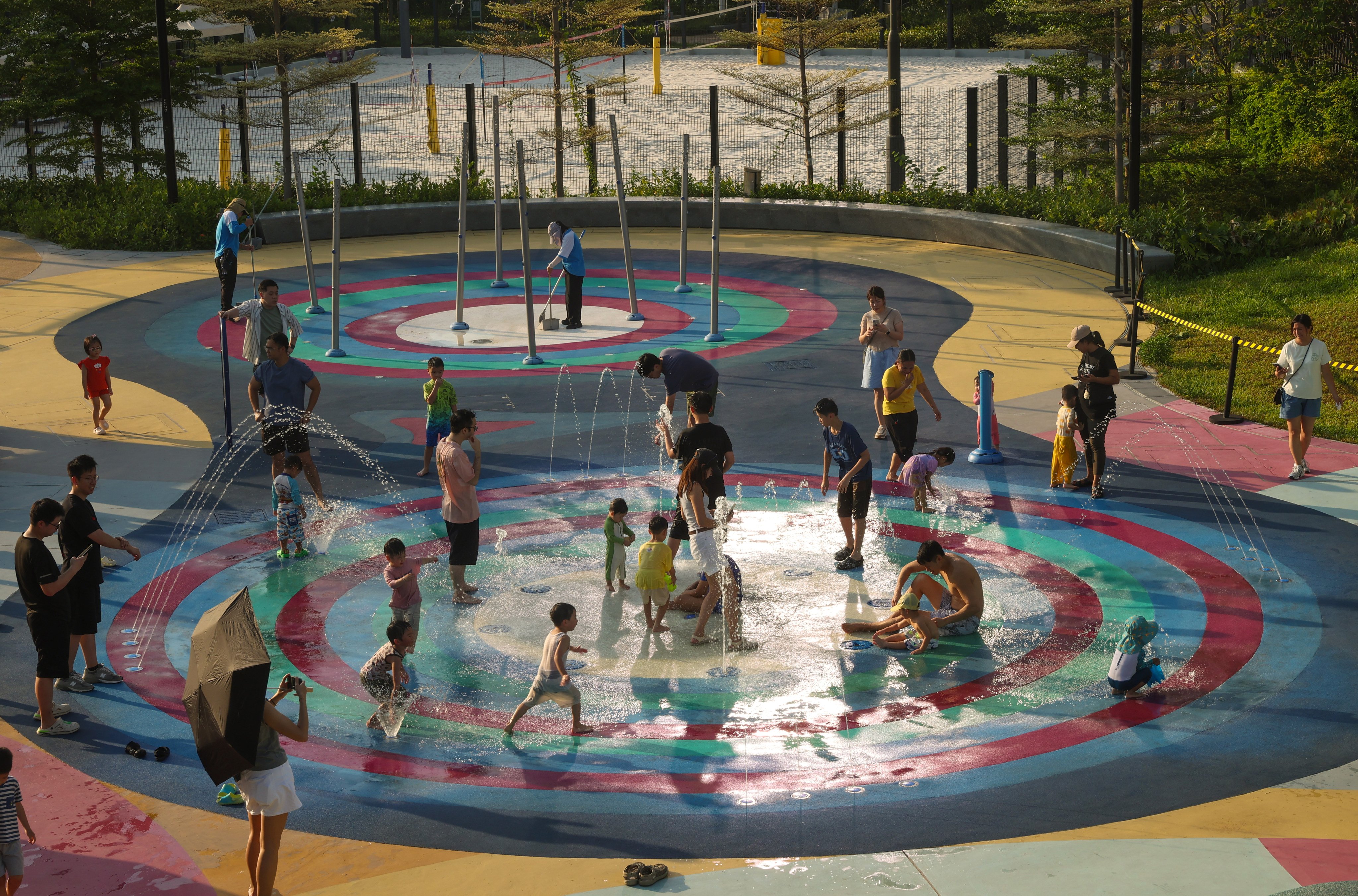 Children play in a fountain at Playfield 5 in Kai Tak during hot weather. Photo: Edmond So