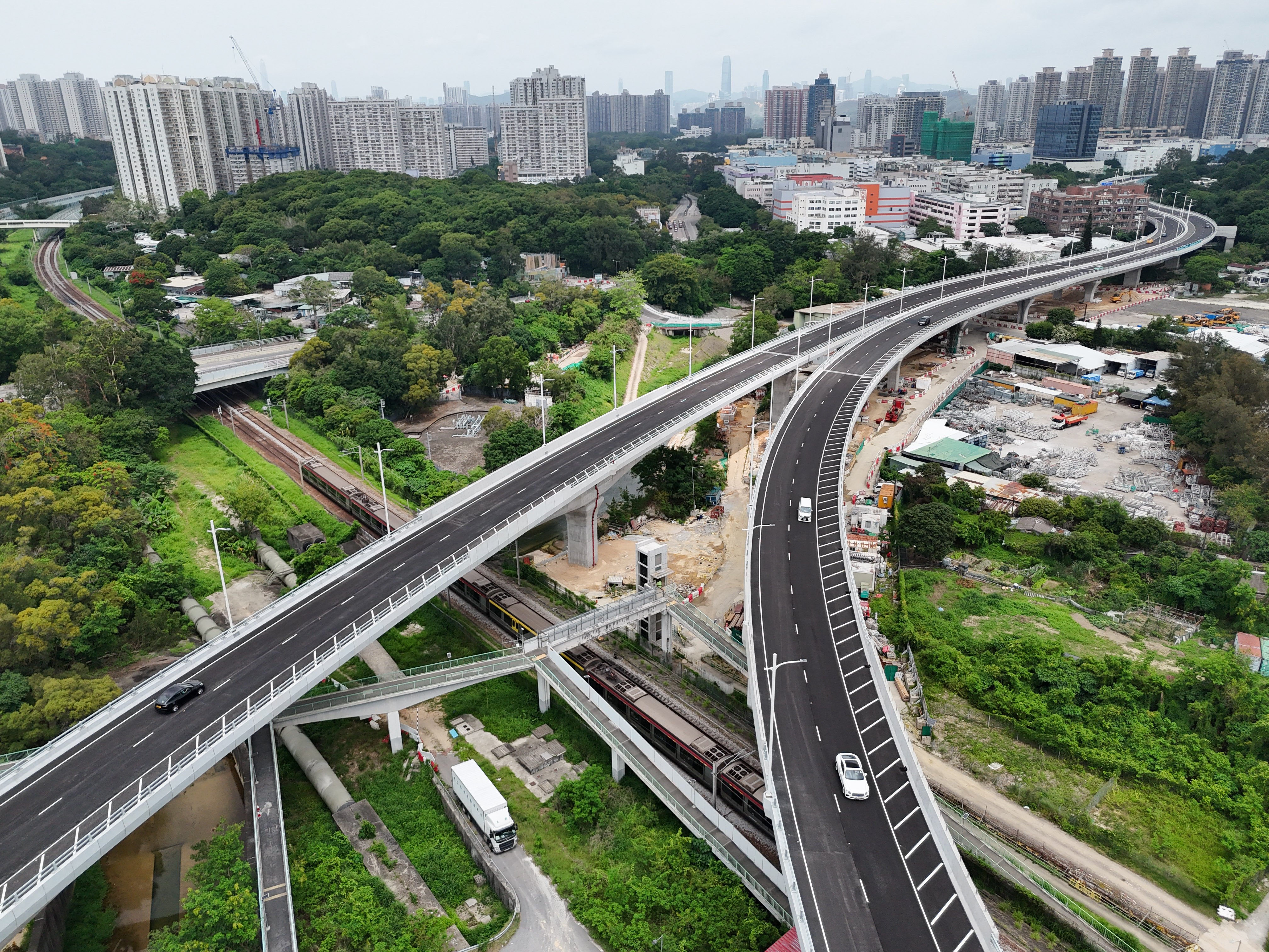 A view of the eastern section of the Fanling Bypass, with the Shenzhen skyline in the distance. In planning the Northern Metropolis, education must be treated as critical infrastructure from the outset, rather than a supporting service. Photo: Eugene Lee