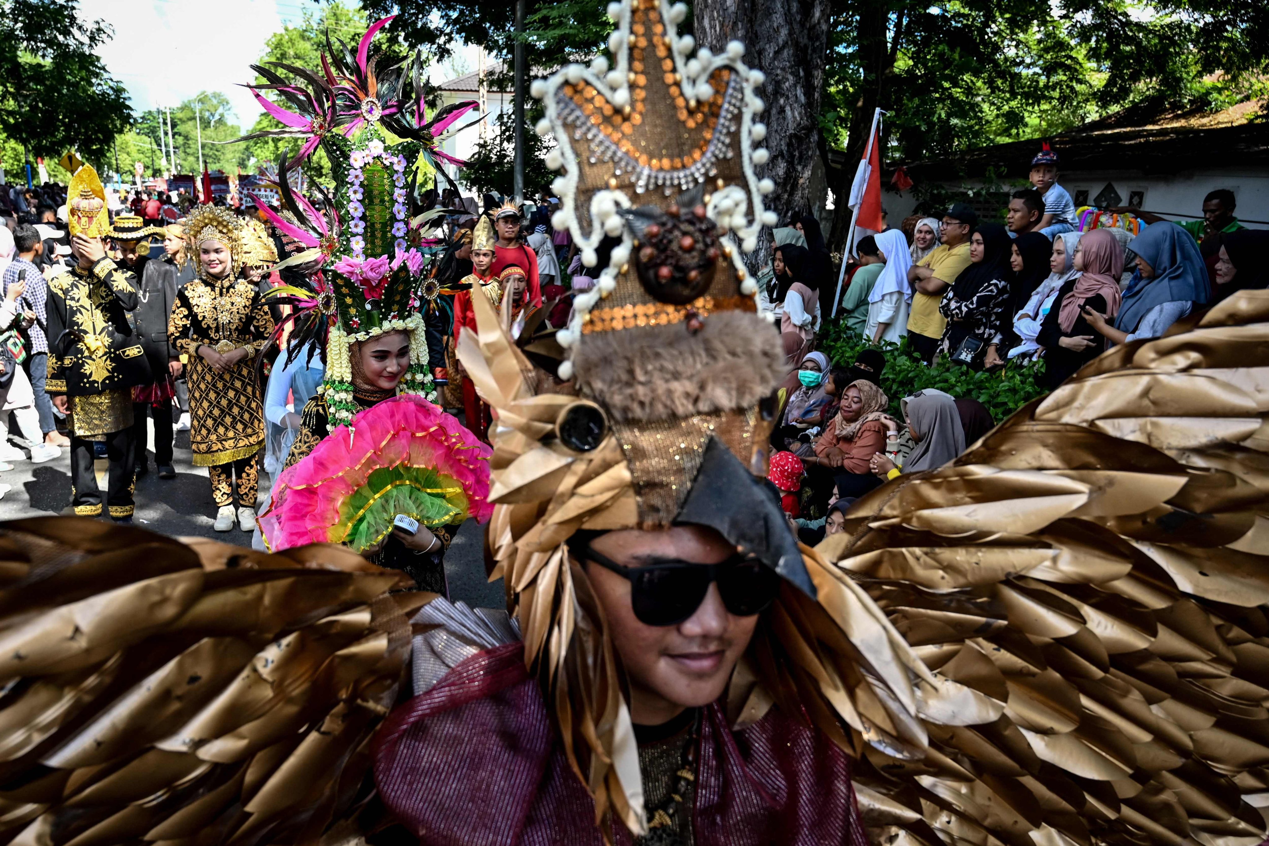 Students take part in the street culture carnival to celebrate Indonesia’s  Independence Day in Banda Aceh on August 19, 2023. Photo: AFP
