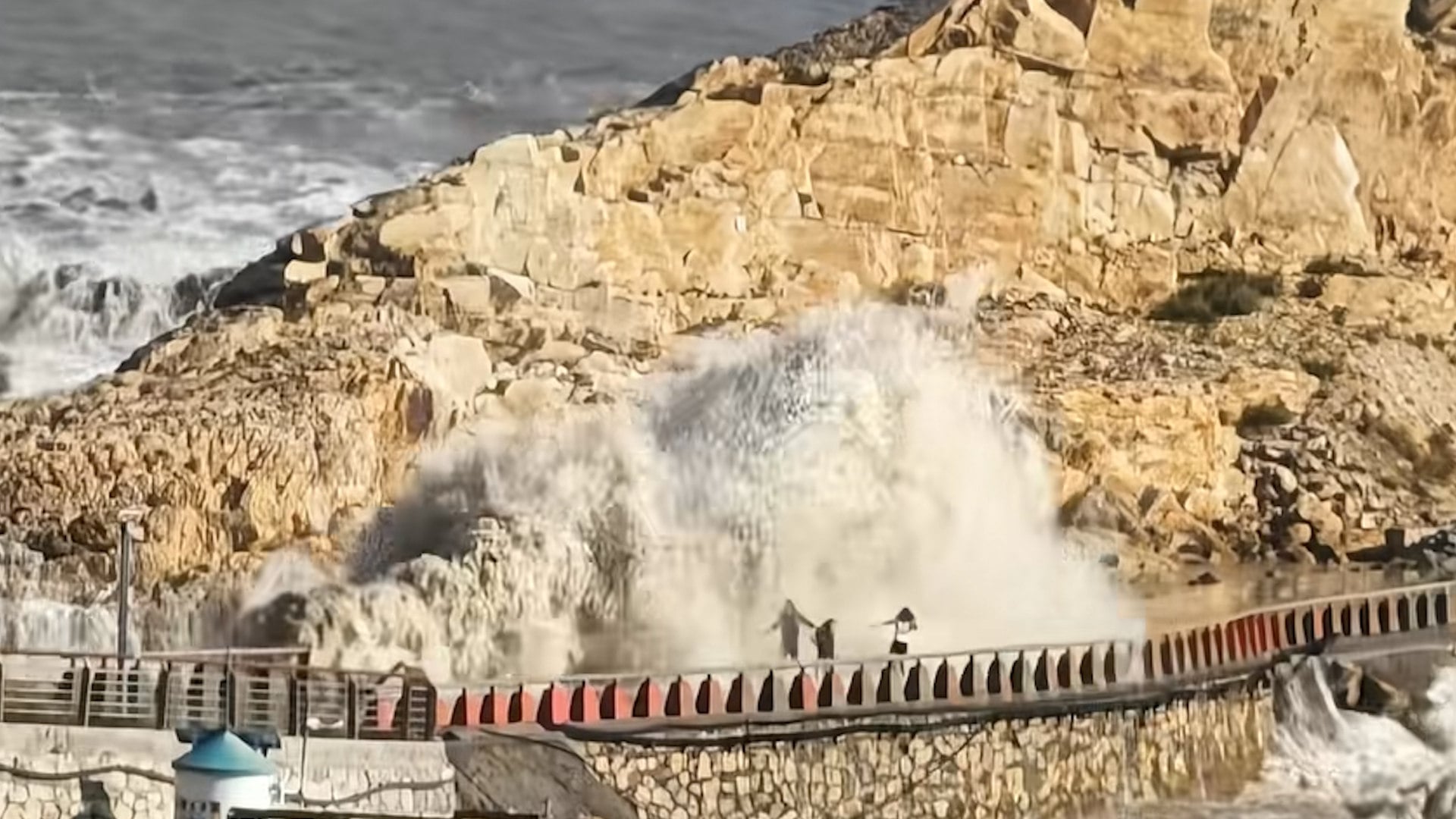 Boy swept away by giant wave