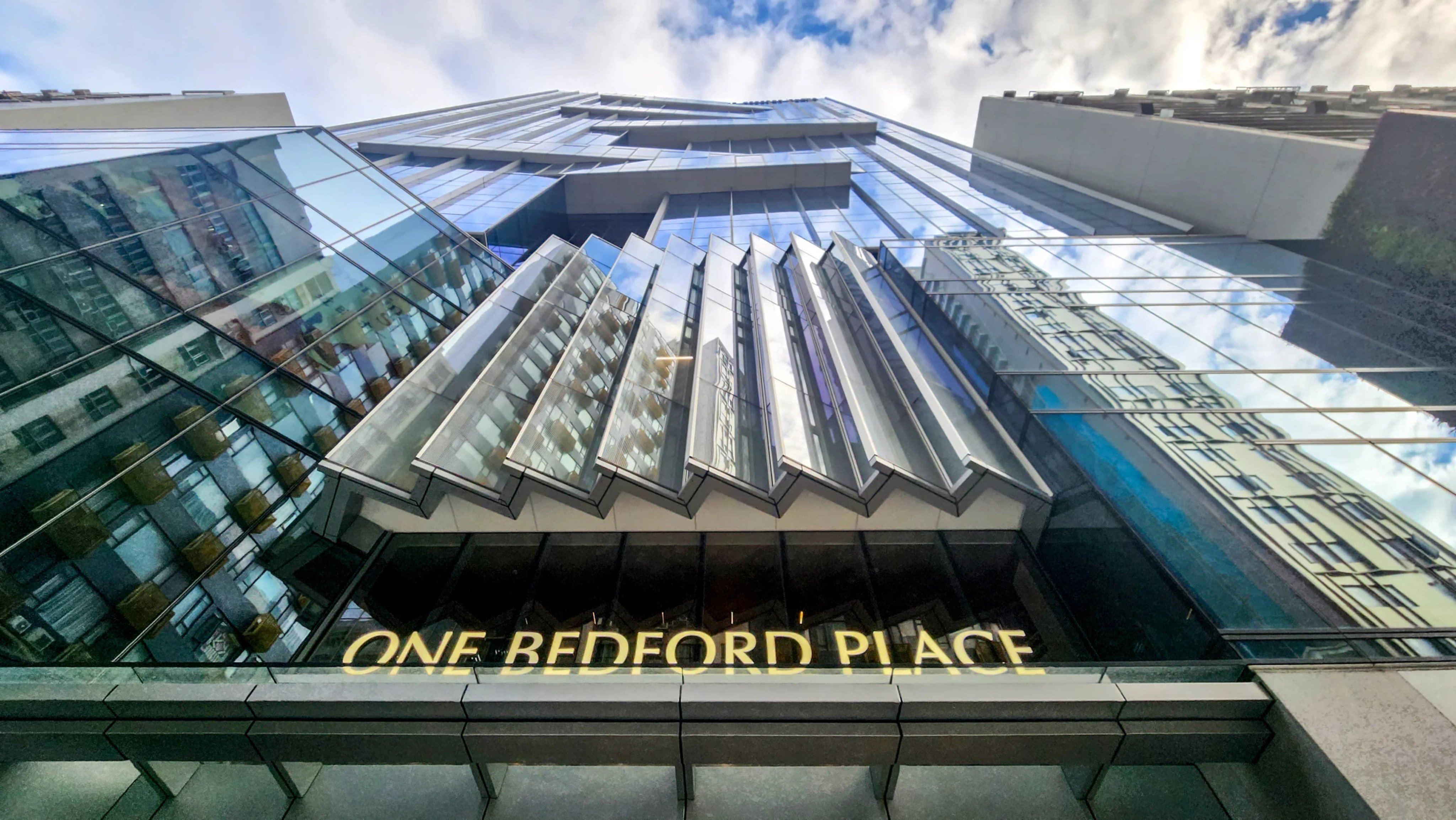 One Bedford Place, a distressed office tower in Tai Kok Tsui, was purchased by Singapore-based investor Wee Hur Holdings in June. Photo: Handout