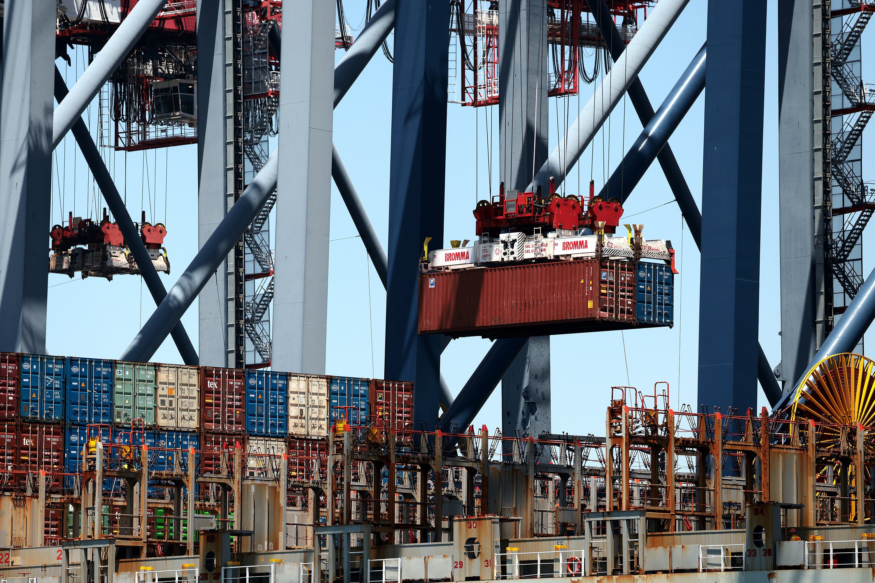 Shipping containers are moved at the Port of Long Beach in May – a month in which the US government disbursed US$21.97 billion in tariff refunds. Photo: TNS