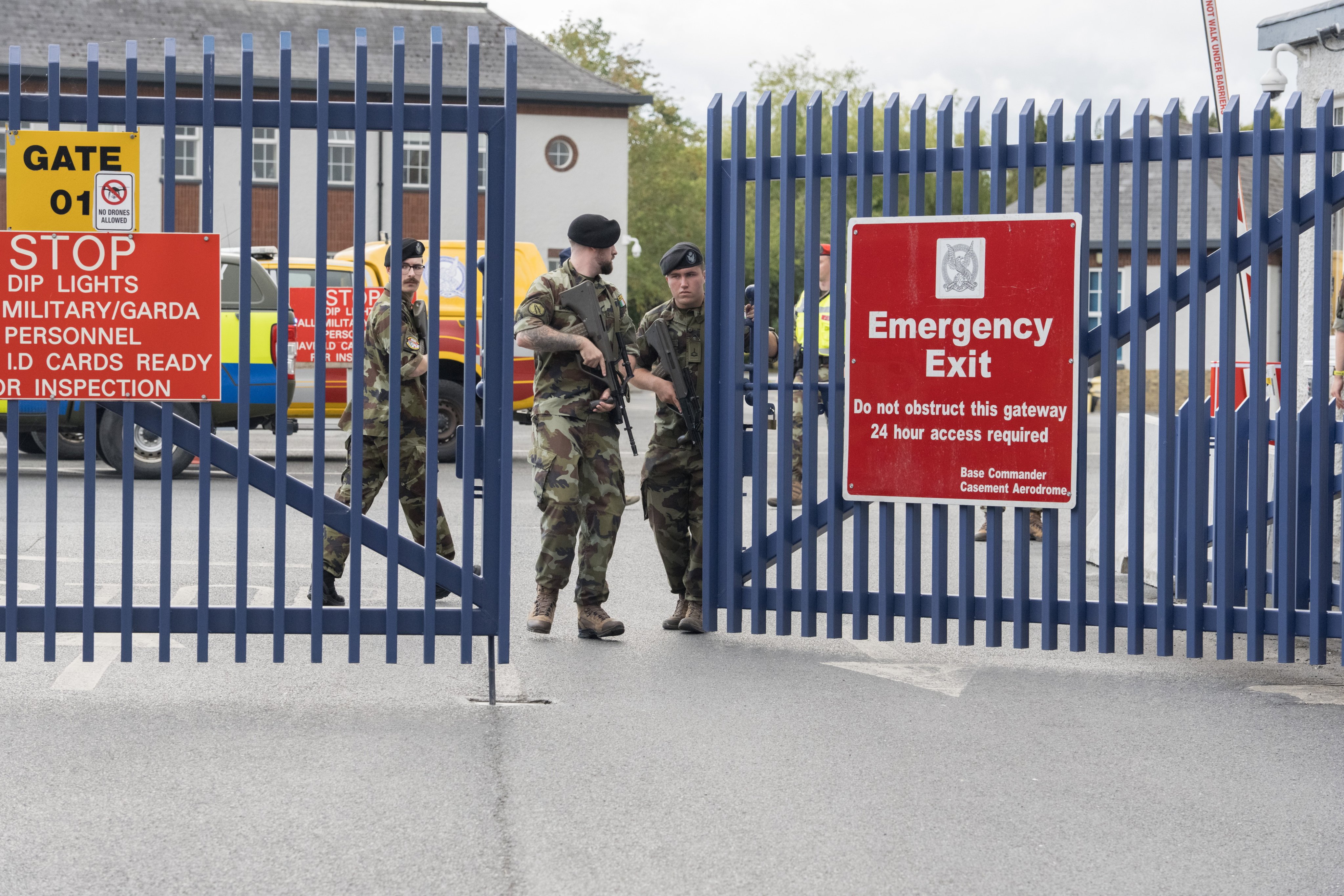 Armed military officers stand guard at Casement Aerodrome, where extradited alleged crime boss Daniel Kinahan landed in Ireland. Photo: EPA