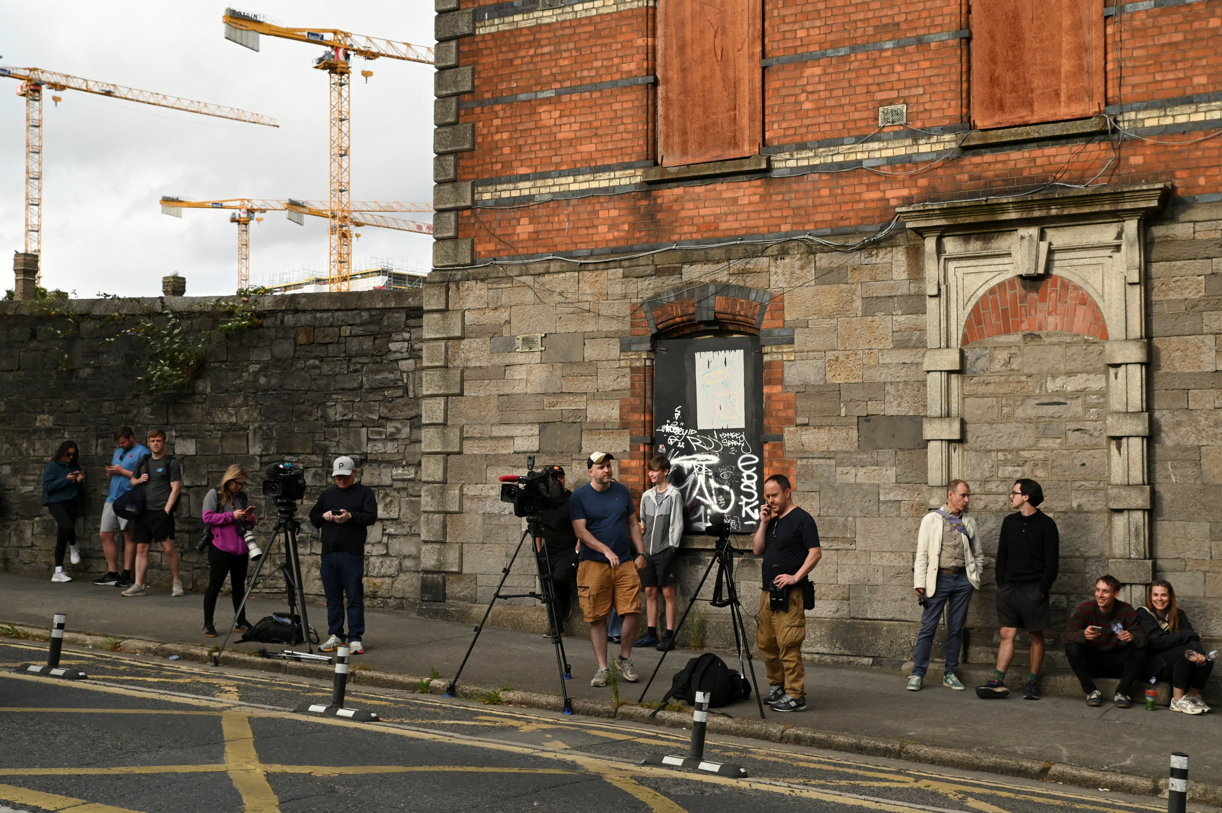 Members of the media wait outside the Special Criminal Court where alleged Irish crime gang boss Daniel Kinahan is expected to appear after being extradited to Ireland from the United Arab Emirates, in Dublin, Ireland on Sunday. Photo: Reuters
