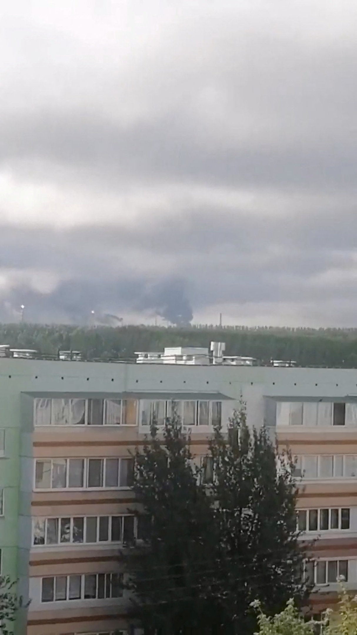 Smoke rises in the distance on Monday after what authorities said was a Ukrainian drone attack on the Russian city of Nizhnekamsk. Photo: Social media via Reuters