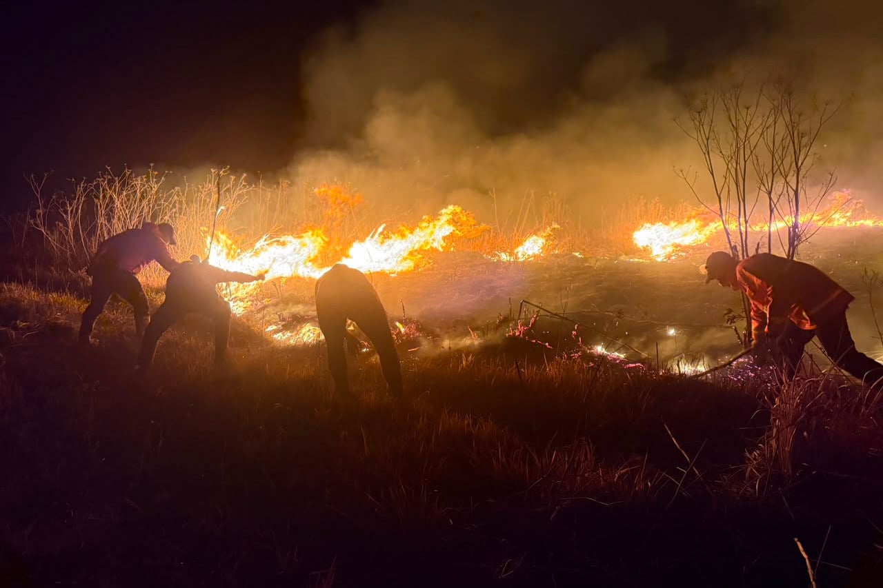 Firefighters attempt to extinguish a wildfire razing through Mount Bromo National Park in Probolinggo on Saturday. Photo: East Java Regional Disaster Mitigation Agency/AP